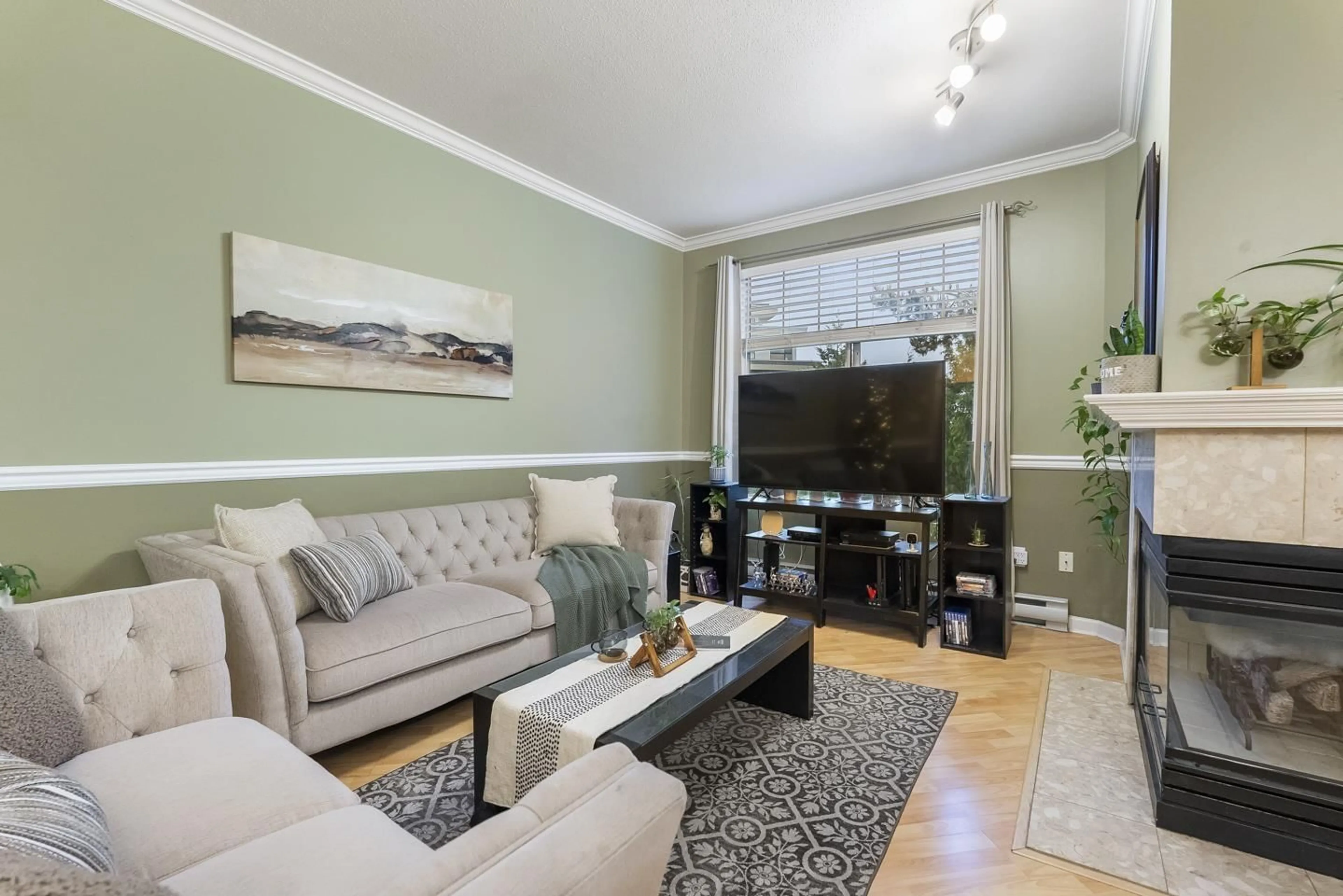 Living room with furniture, wood/laminate floor for 311 - 5677 208 STREET, Langley British Columbia V3A8J5