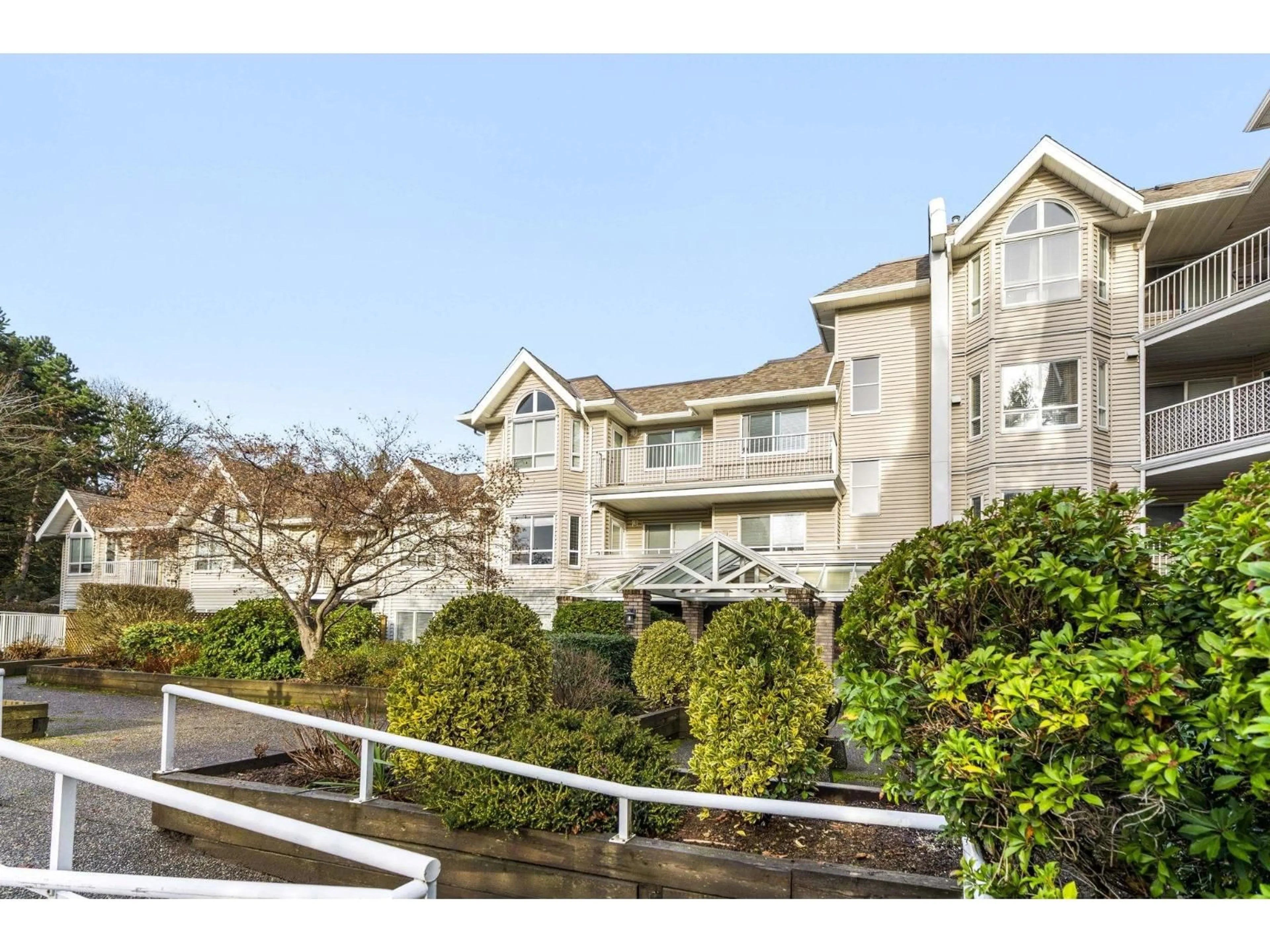 A pic from outside/outdoor area/front of a property/back of a property/a pic from drone, water/lake/river/ocean view for 208 - 13475 96 AVENUE, Surrey British Columbia V3V1Y8