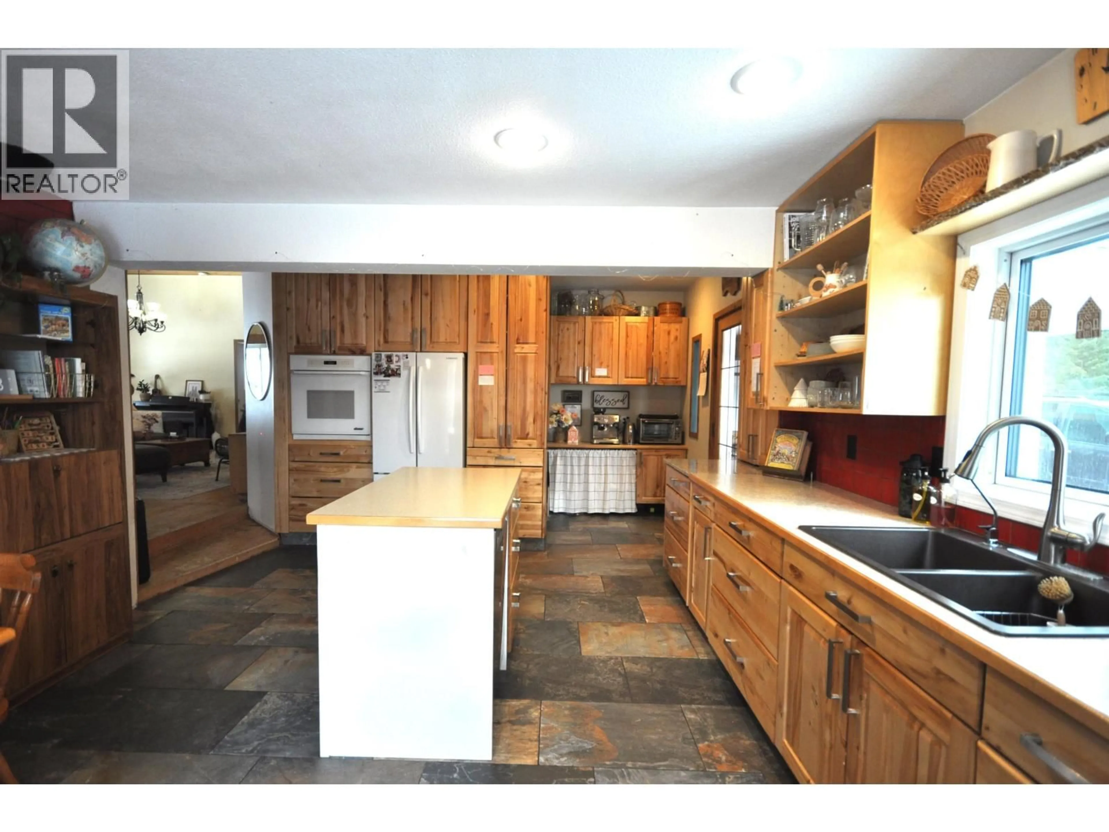 Open concept kitchen, unknown for 2650 ROSE DRIVE, 150 Mile House British Columbia V0K2G0