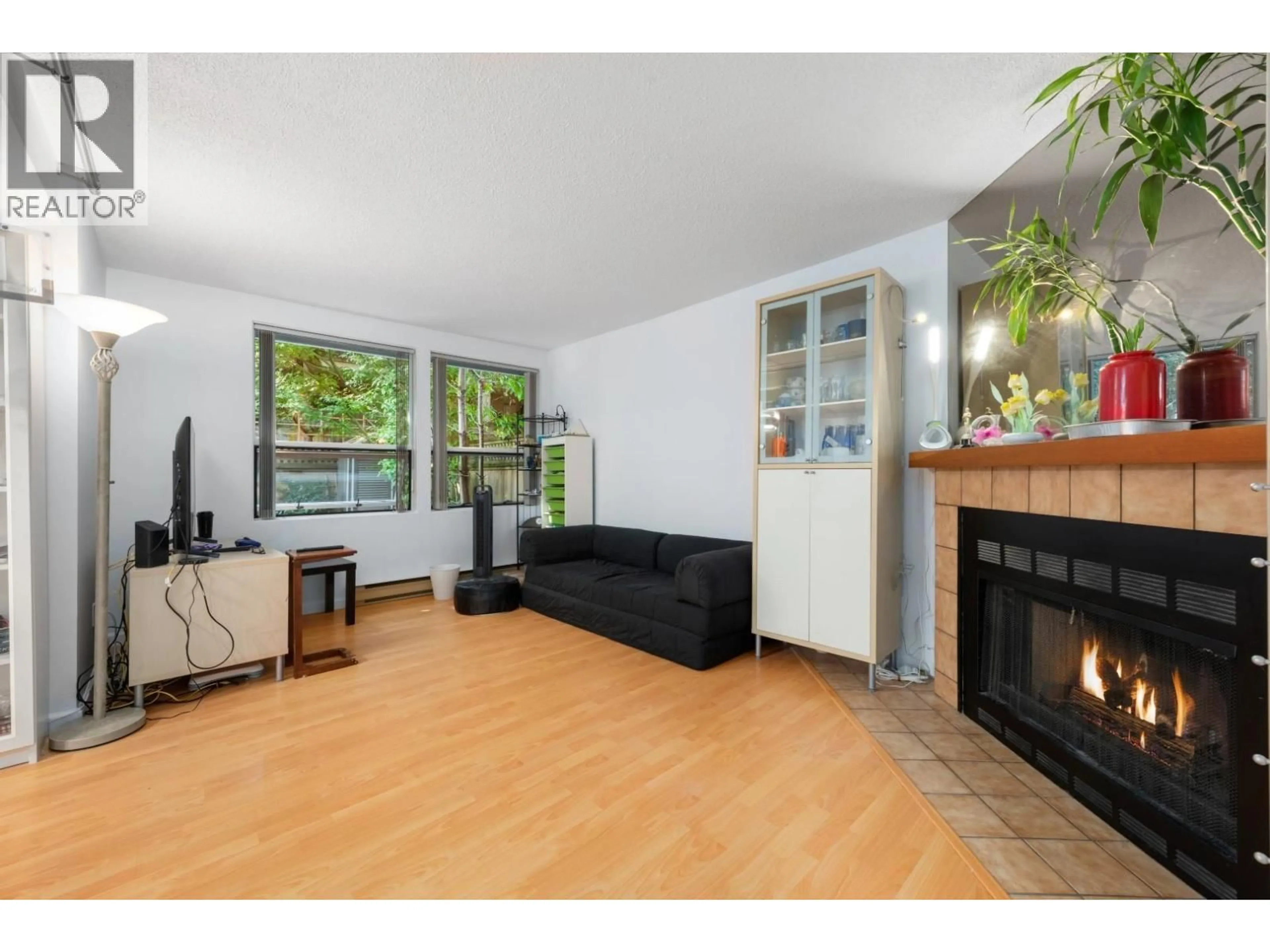 Living room with furniture, wood/laminate floor for 3 - 6771 COONEY ROAD, Richmond British Columbia V6Y2J9