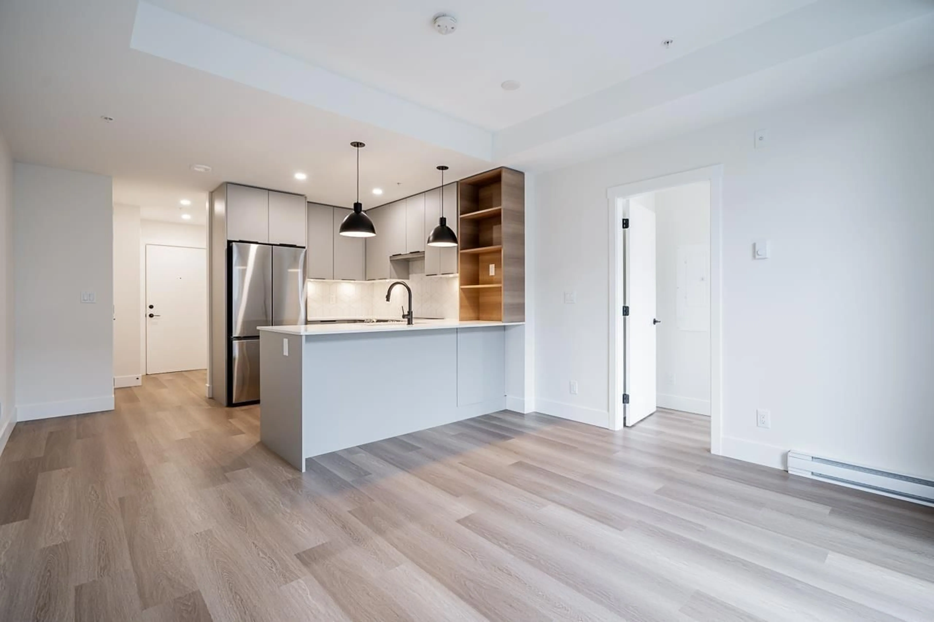 Open concept kitchen, wood/laminate floor for 405 - 10778 138 STREET, Surrey British Columbia V3T5T2