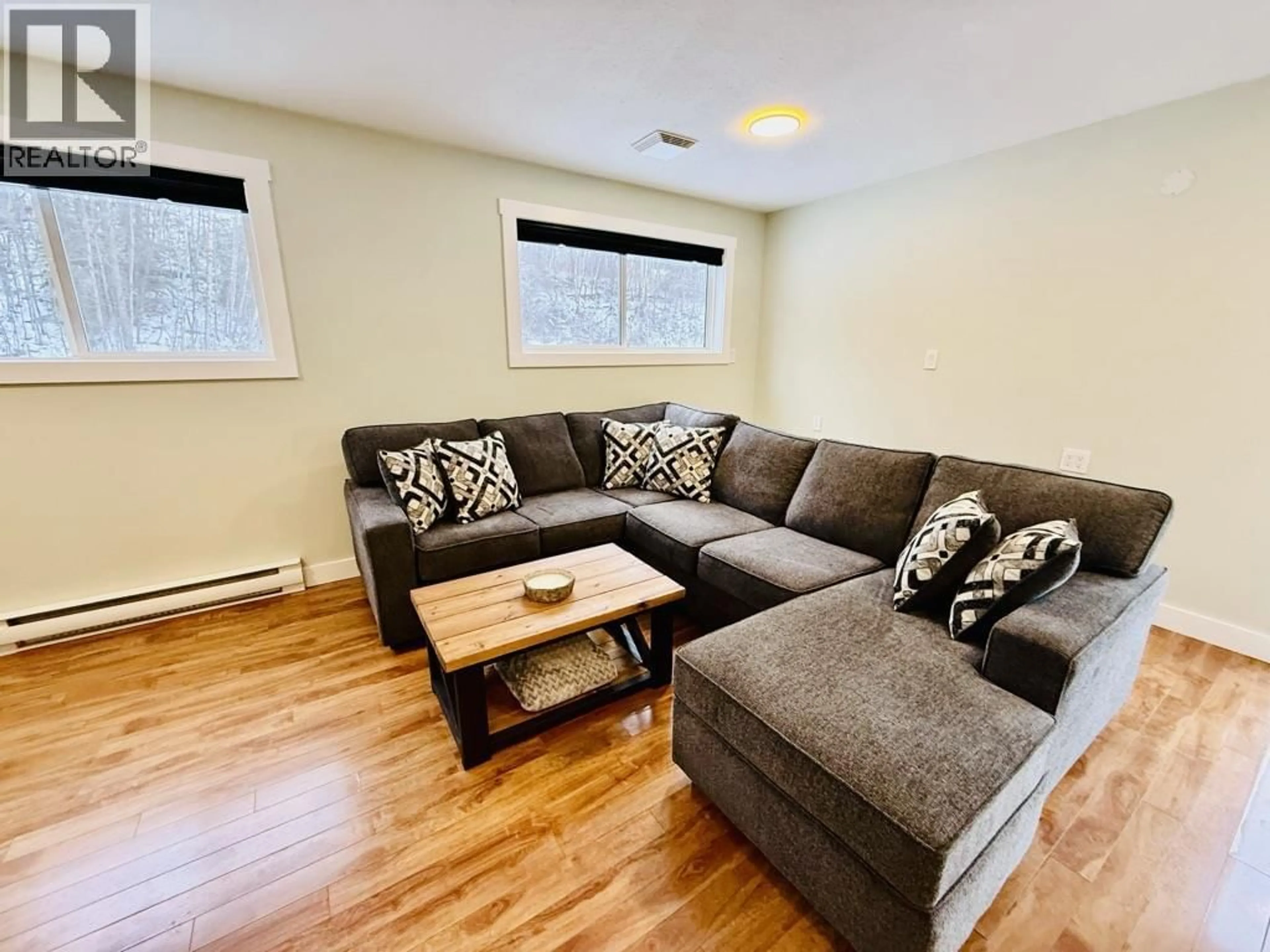 Living room with furniture, wood/laminate floor for 1485 WILLOW STREET, Telkwa British Columbia V0J2X0