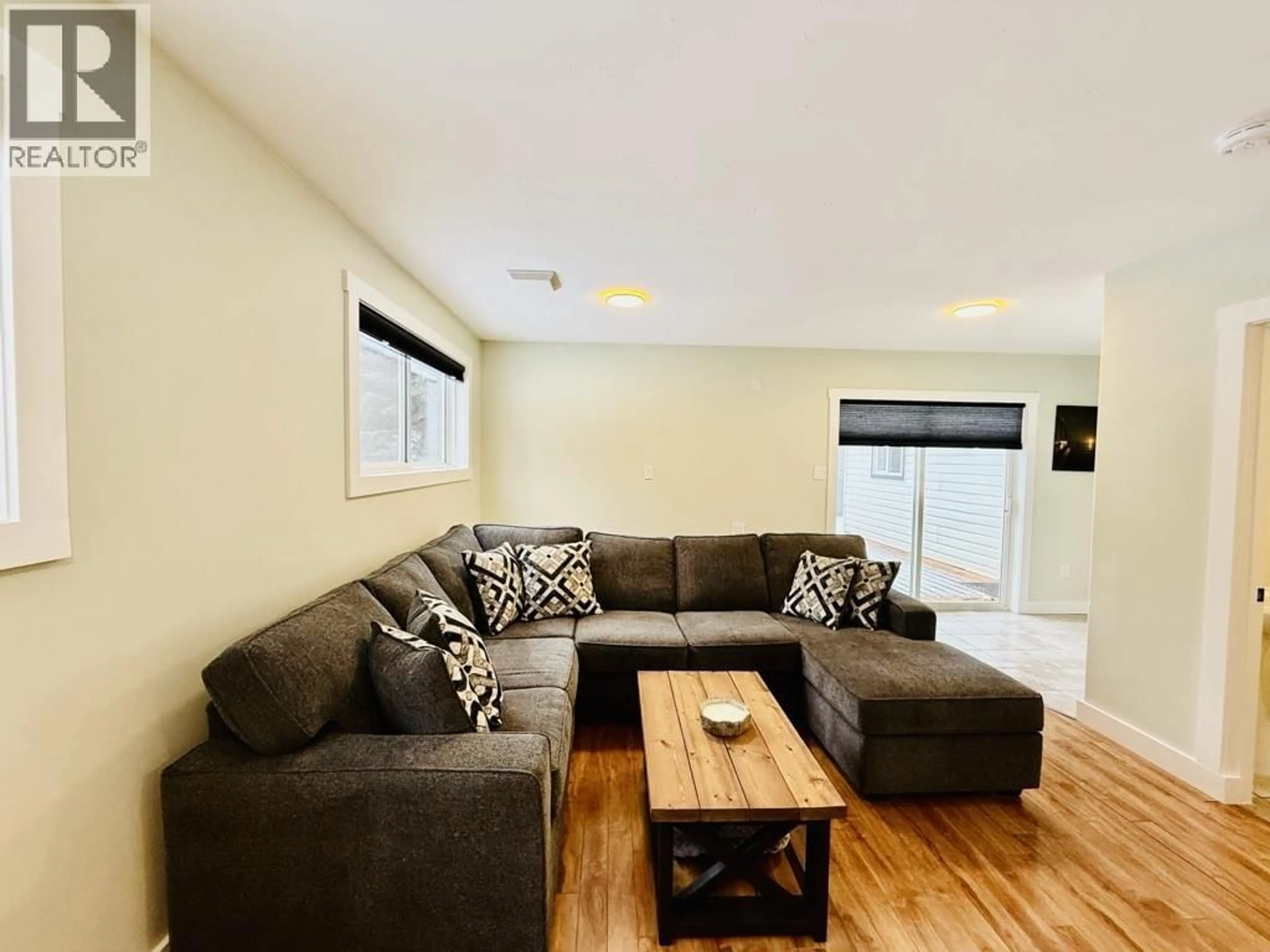 Living room with furniture, wood/laminate floor for 1485 WILLOW STREET, Telkwa British Columbia V0J2X0