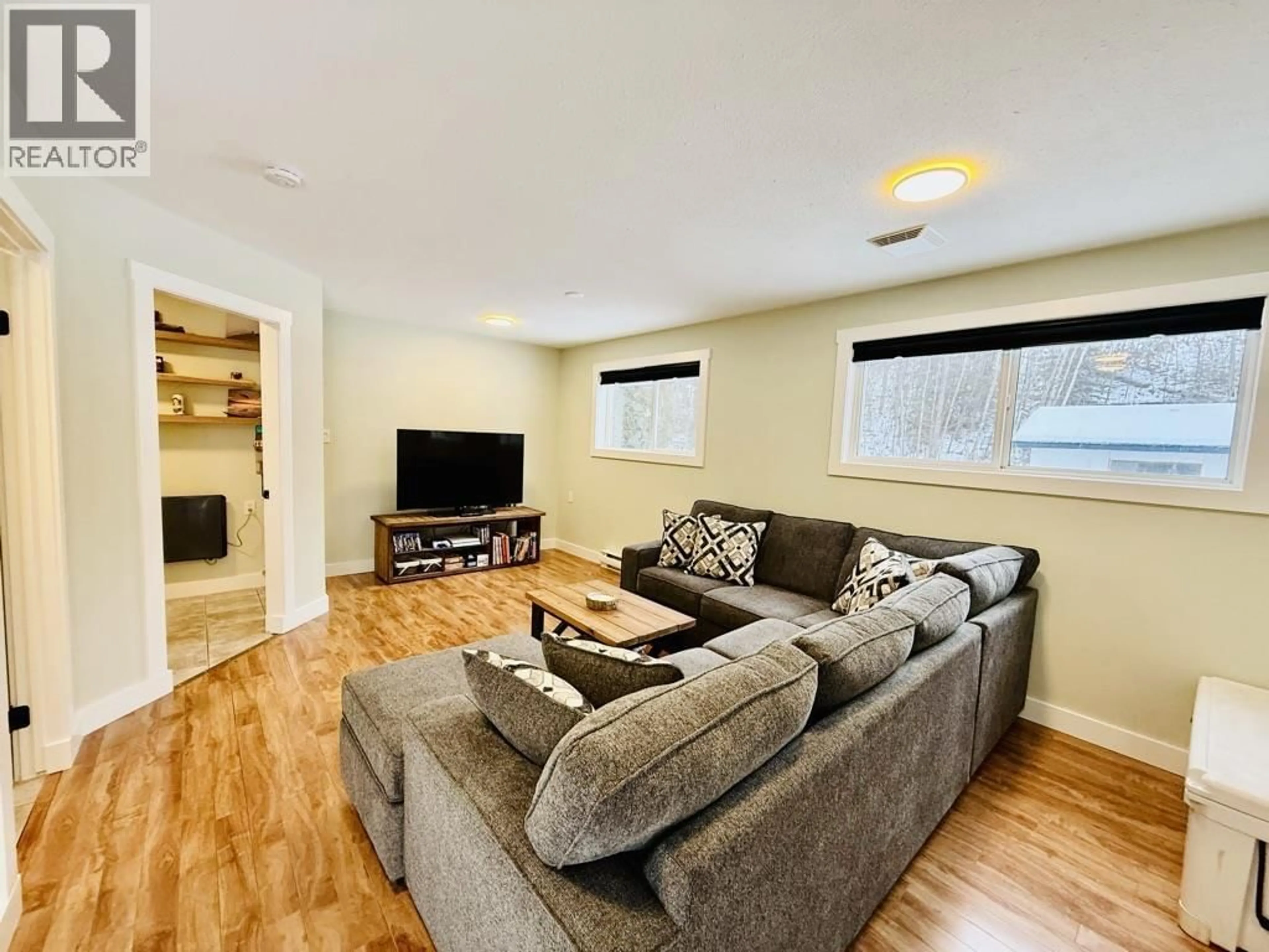 Living room with furniture, wood/laminate floor for 1485 WILLOW STREET, Telkwa British Columbia V0J2X0