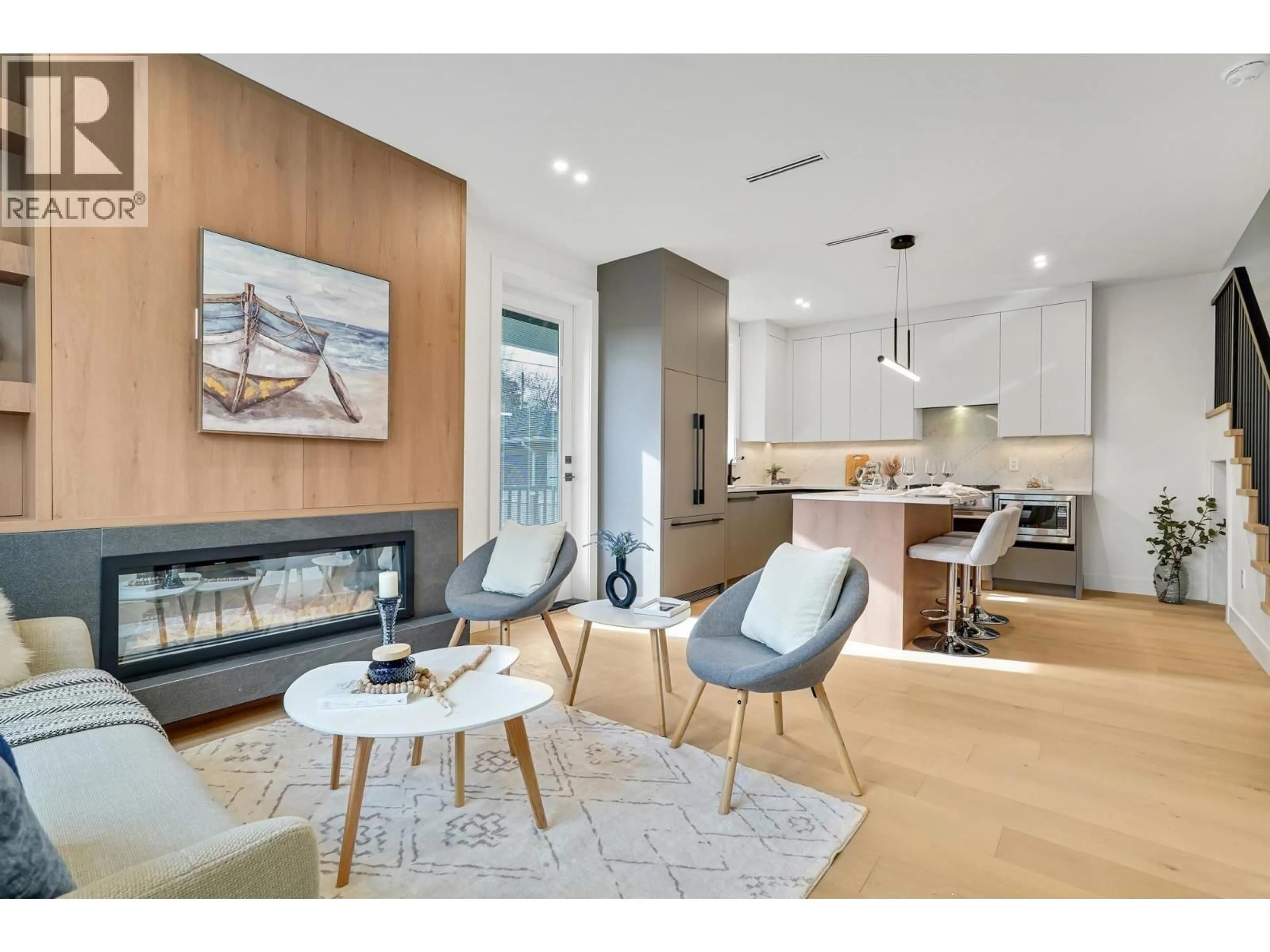 Open concept kitchen, wood/laminate floor for 3483 ADANAC STREET, Vancouver British Columbia V5K4P4