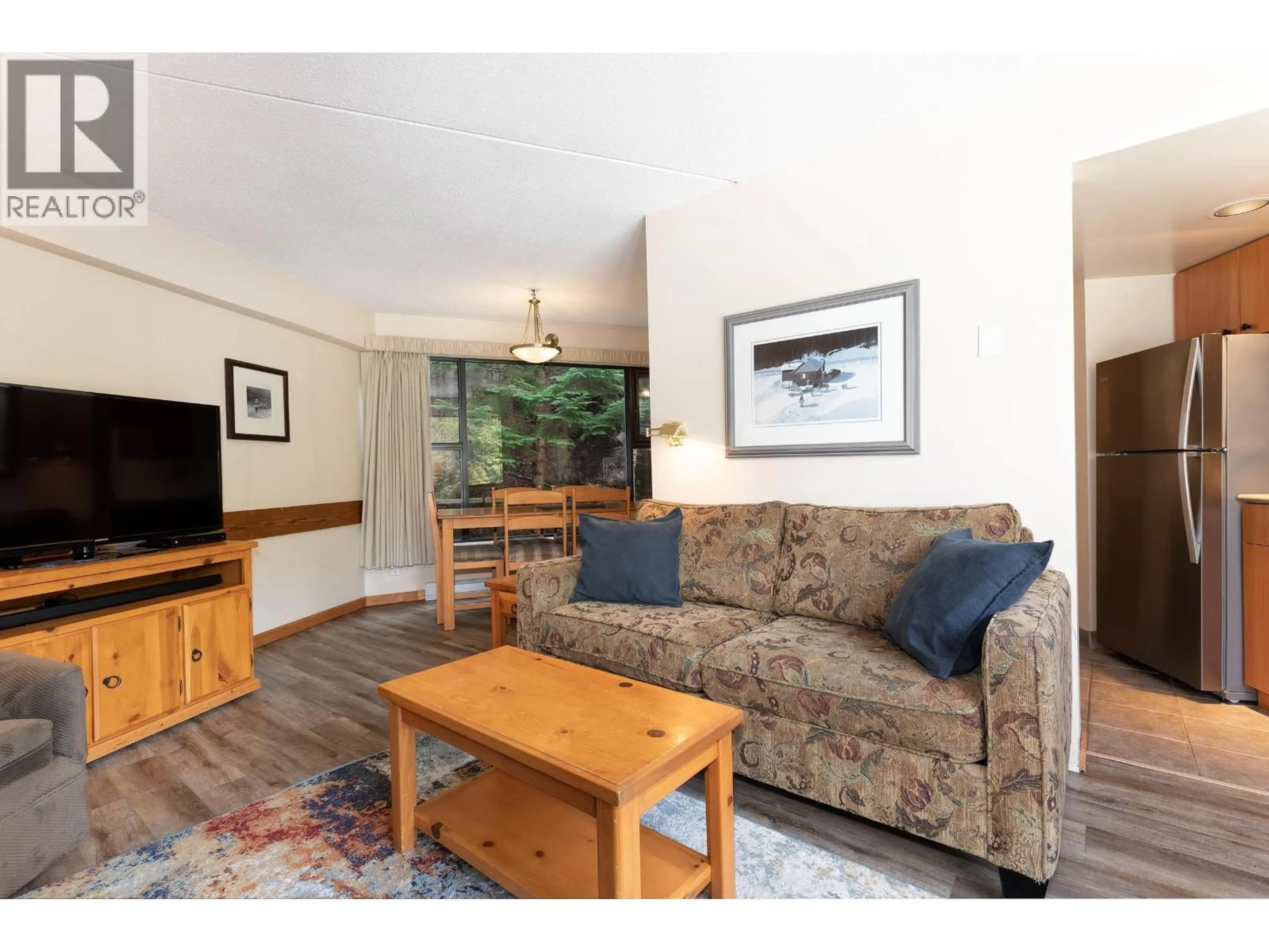 Living room with furniture, wood/laminate floor for 6A - 2561 TRICOUNI PLACE, Whistler British Columbia V8E0A8