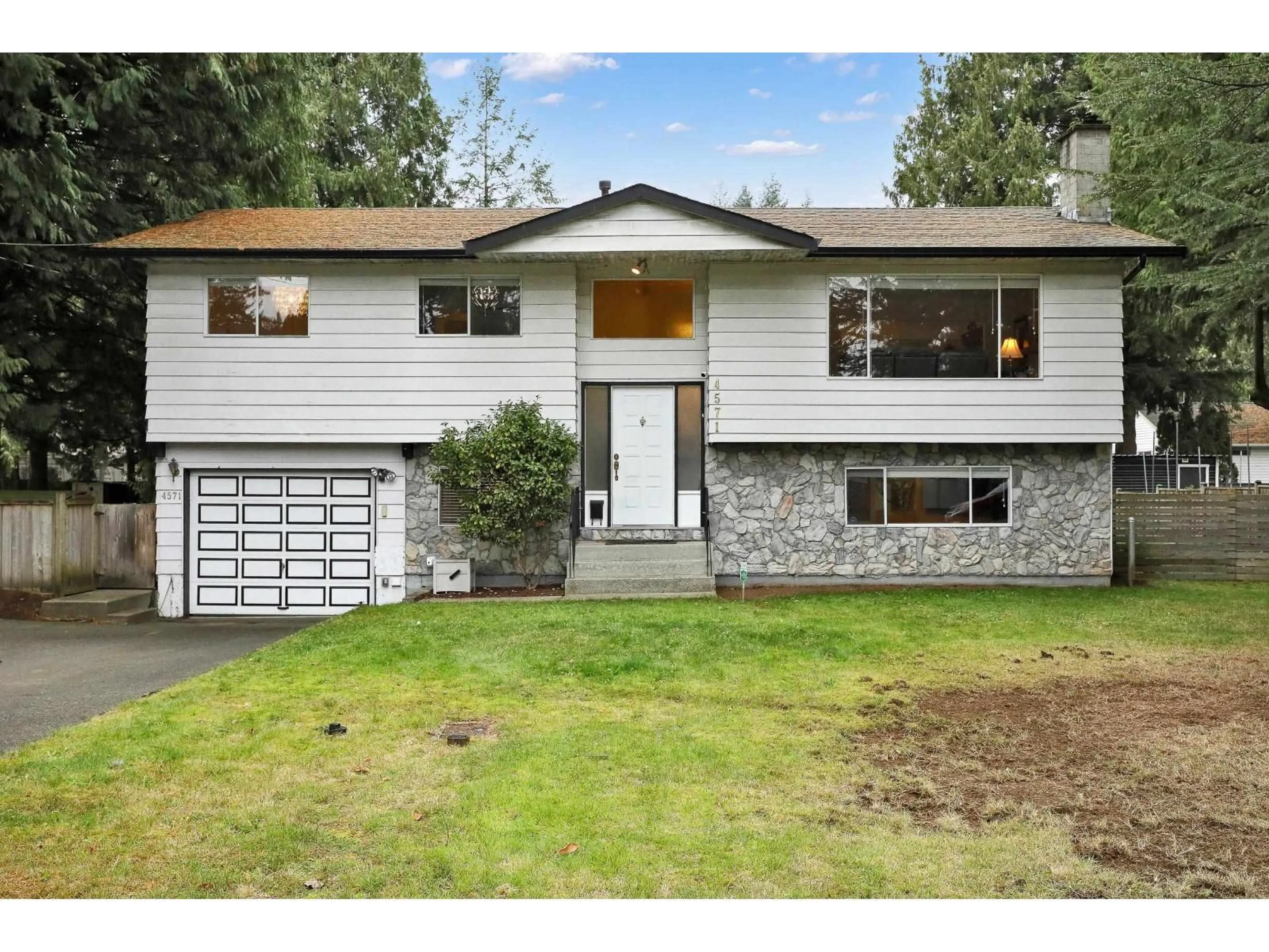 Home with vinyl exterior material, street for 4571 198 STREET, Langley British Columbia V3A1E7