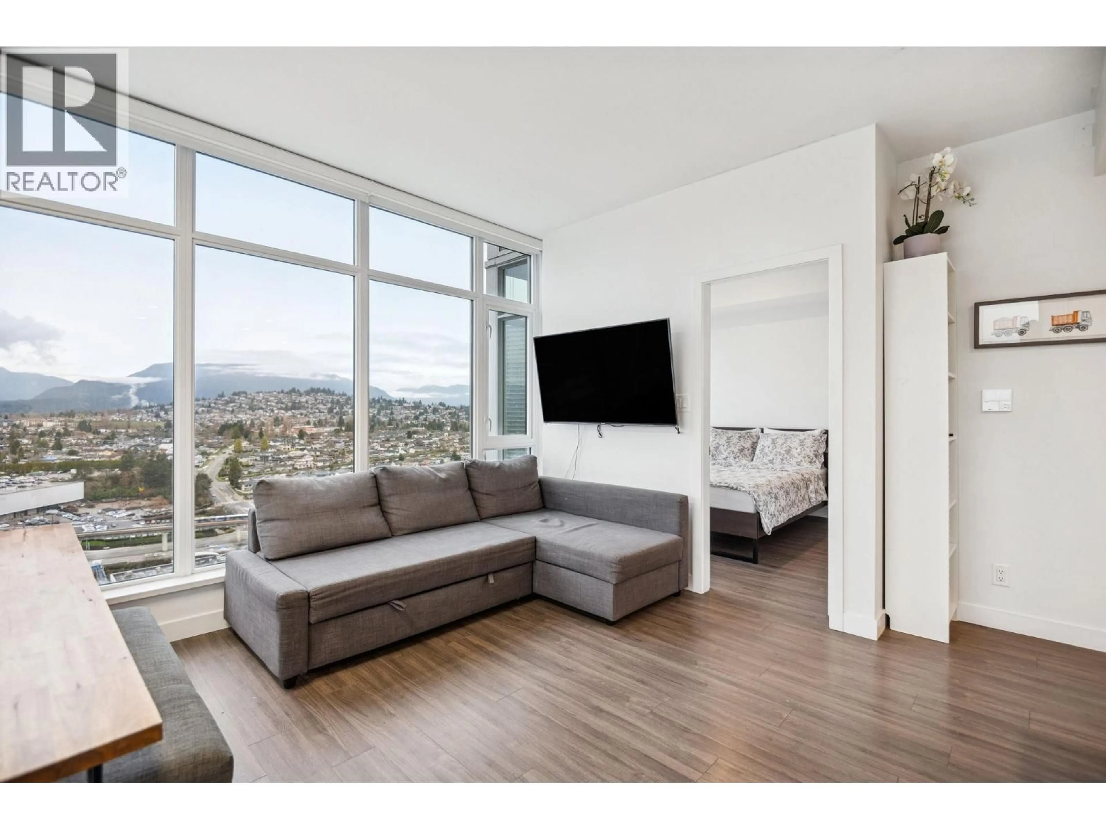 Living room with furniture, wood/laminate floor for 3207 - 2311 BETA AVENUE, Burnaby British Columbia V5C0M1
