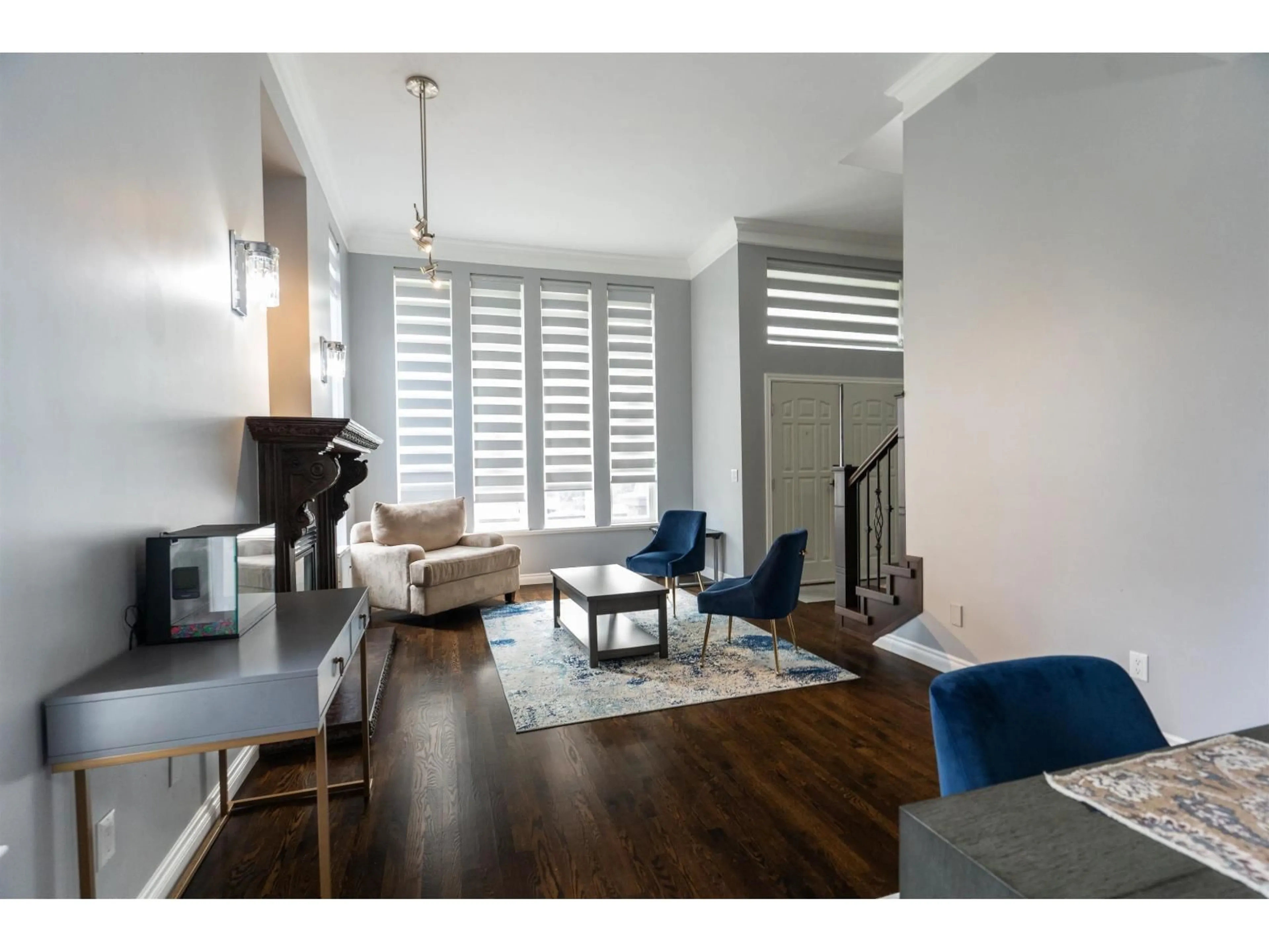 Living room with furniture, wood/laminate floor for 14135 90A AVENUE, Surrey British Columbia V3V8E1