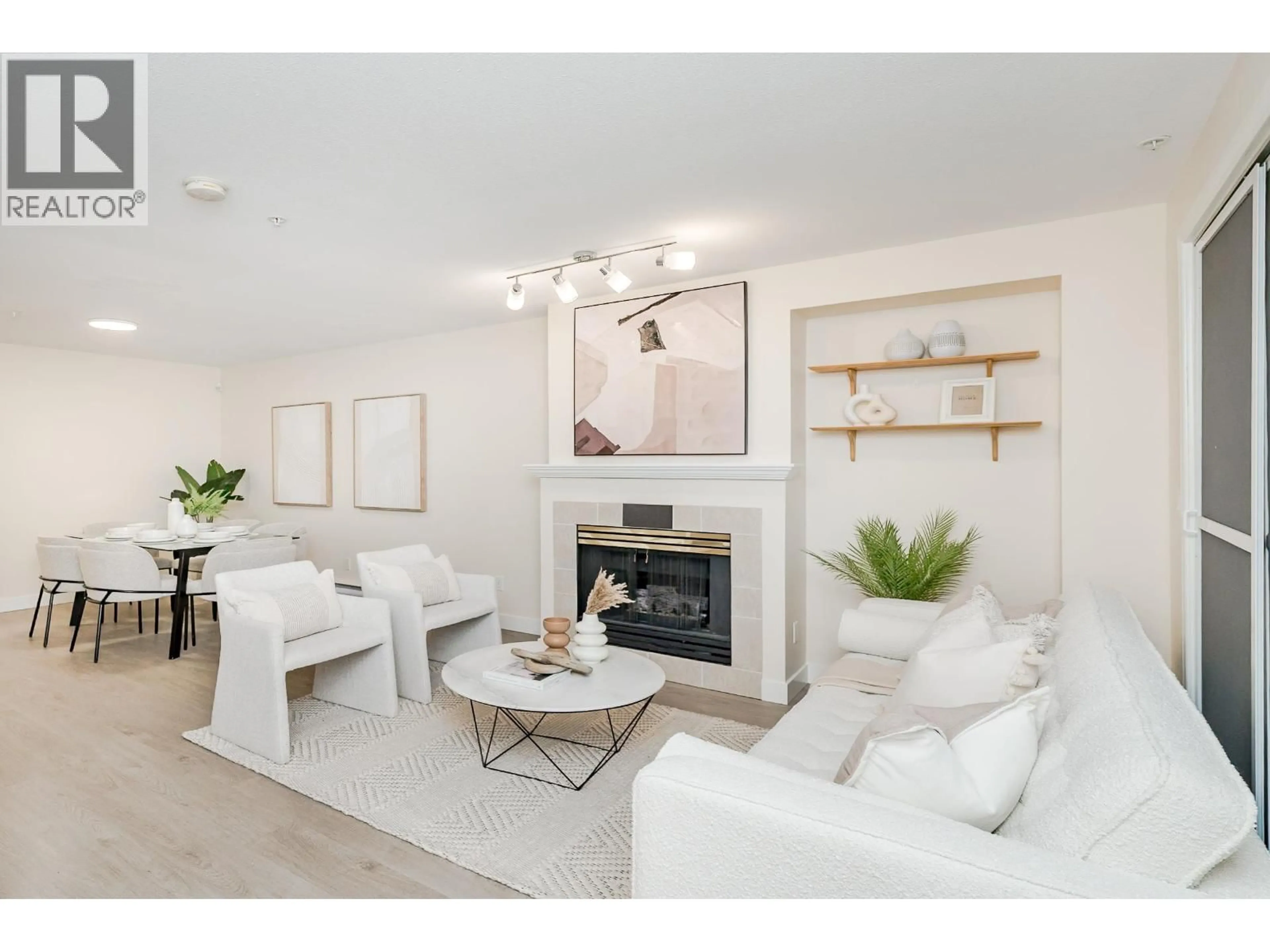 Living room with furniture, wood/laminate floor for 49 - 6588 SOUTHOAKS CRESCENT, Burnaby British Columbia V5E4K1