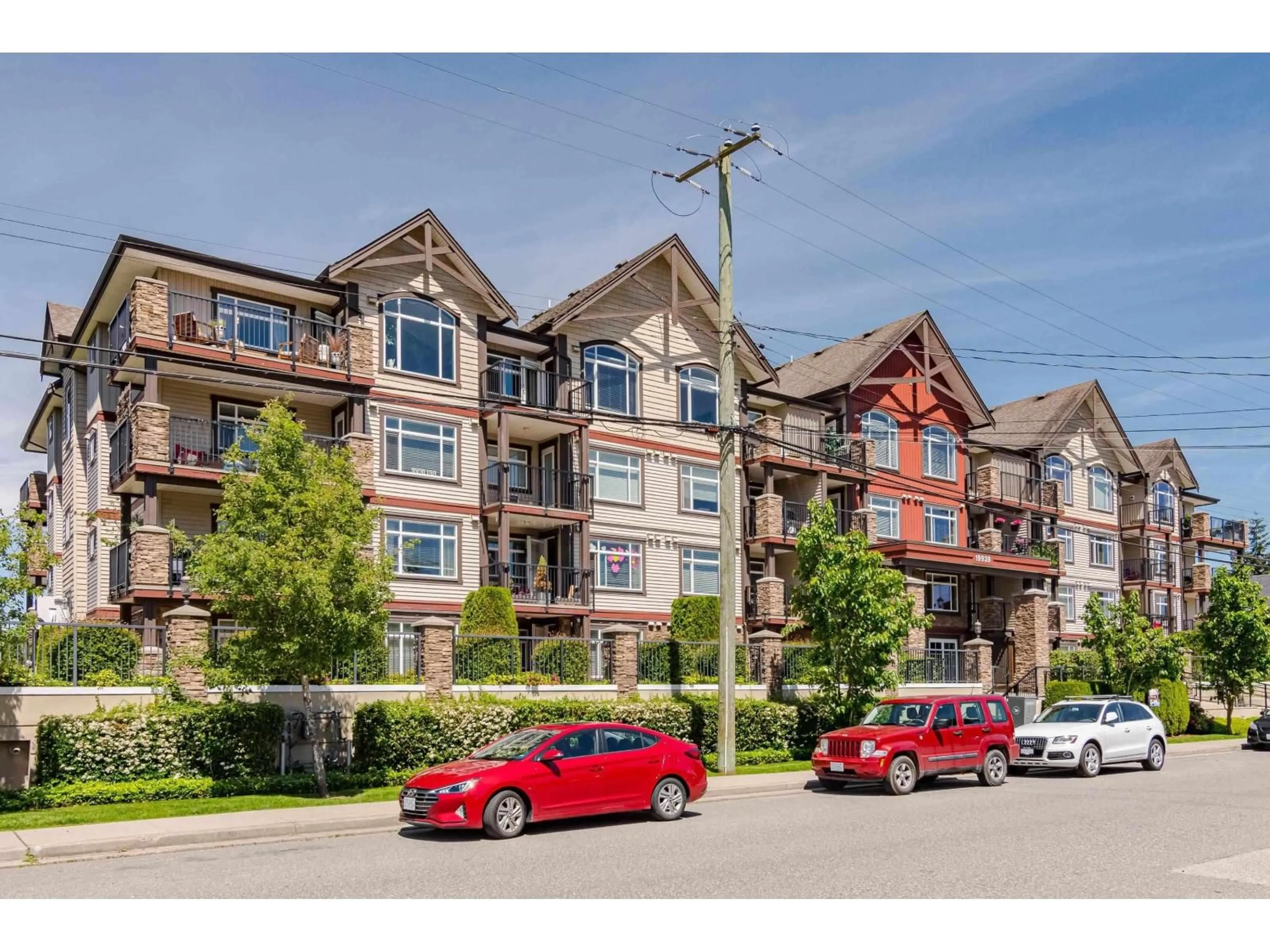 A pic from outside/outdoor area/front of a property/back of a property/a pic from drone, mountain view for 409 - 19939 55A AVENUE AVENUE, Langley British Columbia V3A3X4