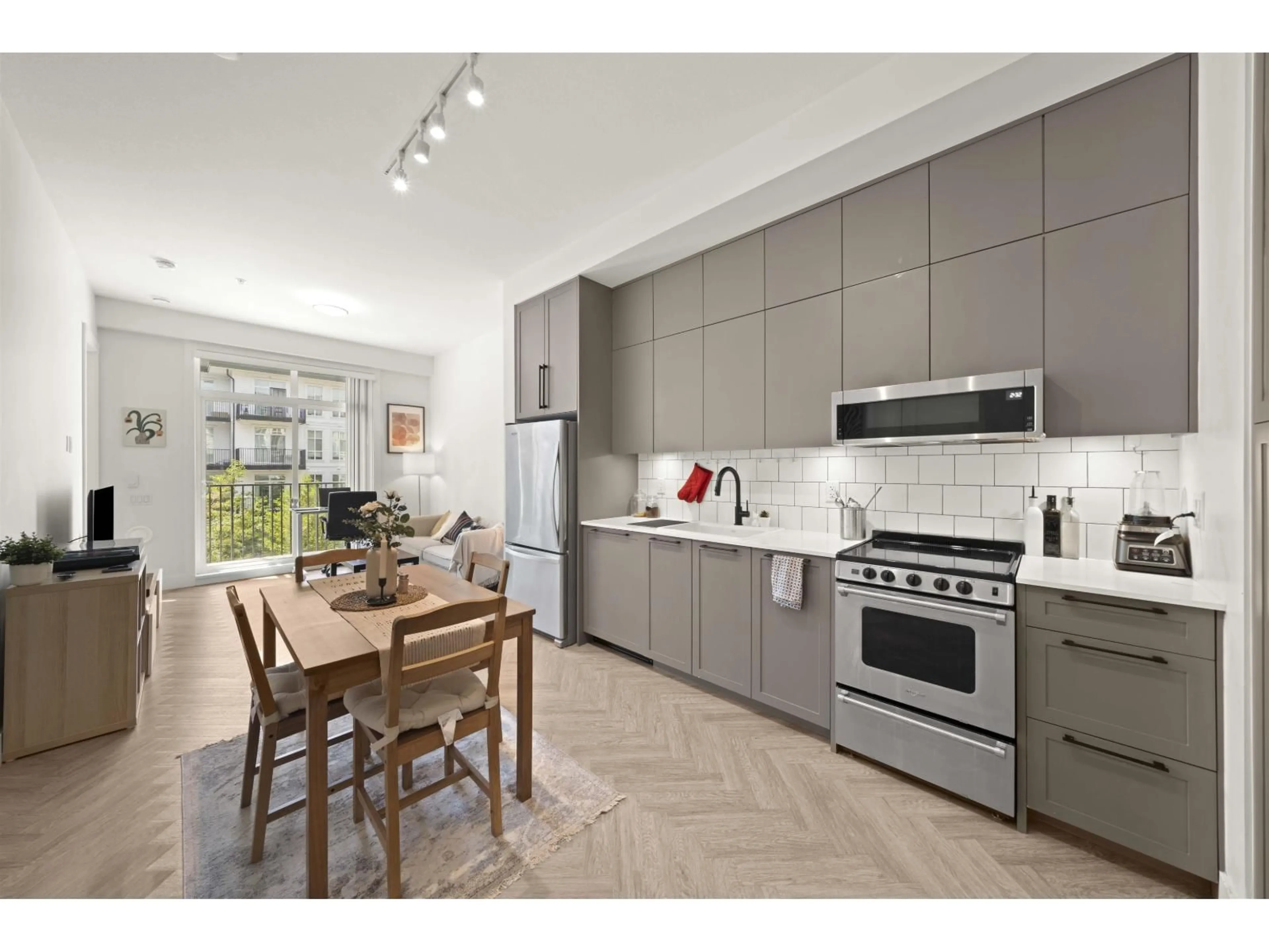 Open concept kitchen, ceramic/tile floor for 201 - 13933 105 BOULEVARD, Surrey British Columbia V3T0R6