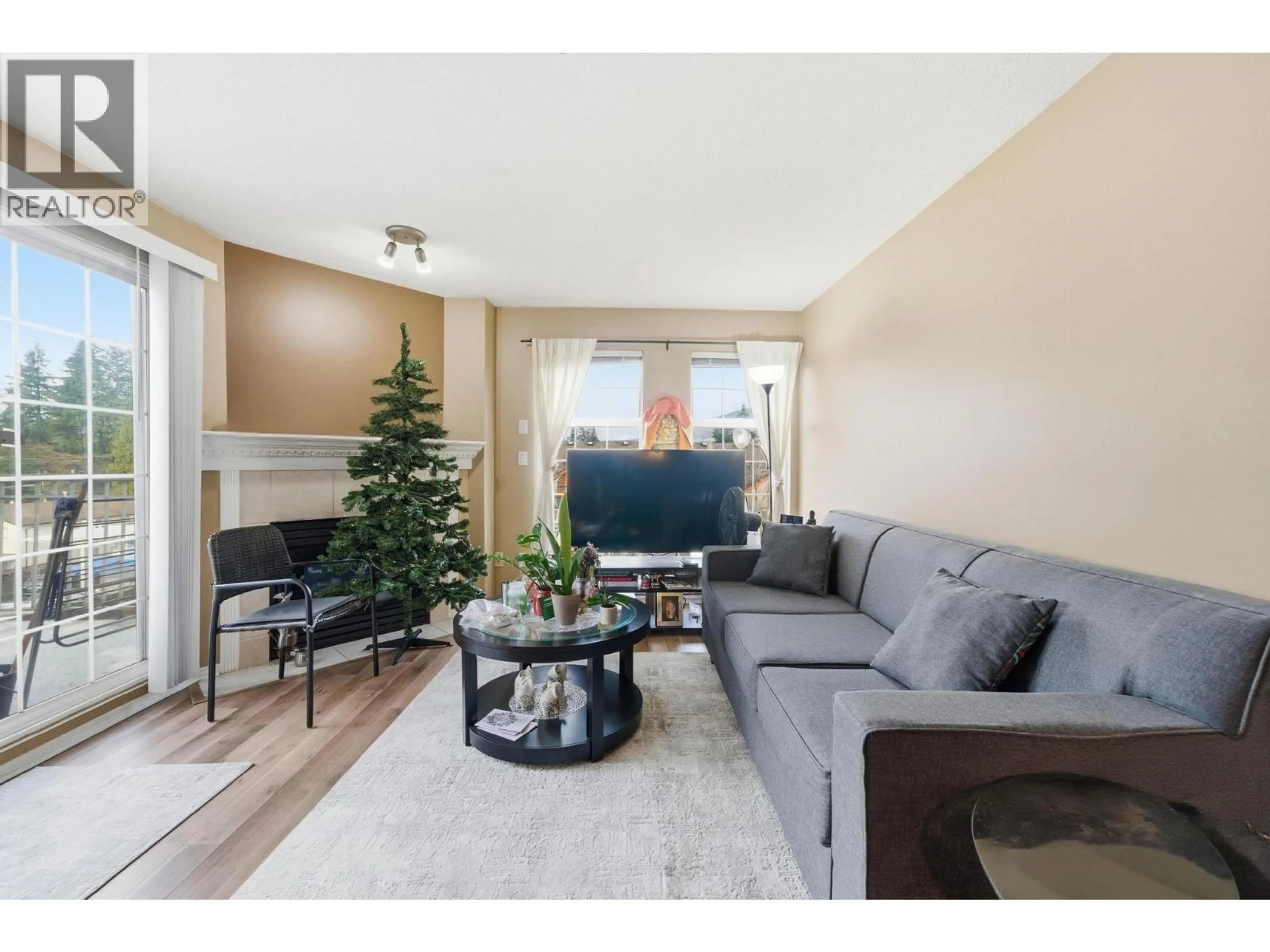 Living room with furniture, wood/laminate floor for 404 - 1655 GRANT AVENUE, Port Coquitlam British Columbia V3B7V1