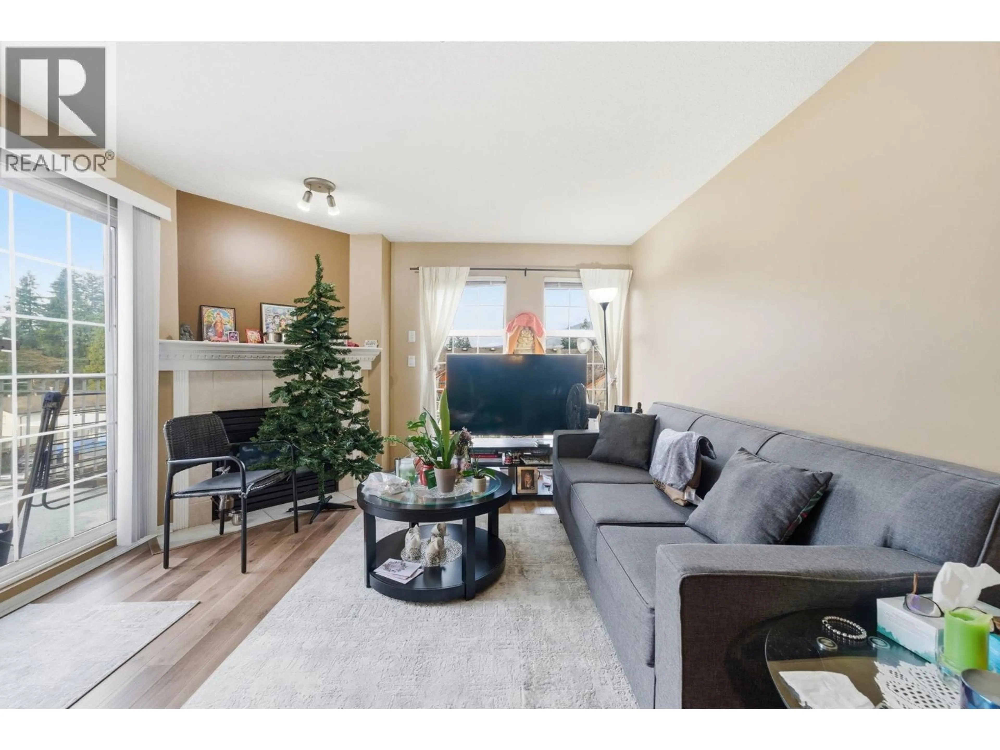 Living room with furniture, wood/laminate floor for 404 - 1655 GRANT AVENUE, Port Coquitlam British Columbia V3B7V1