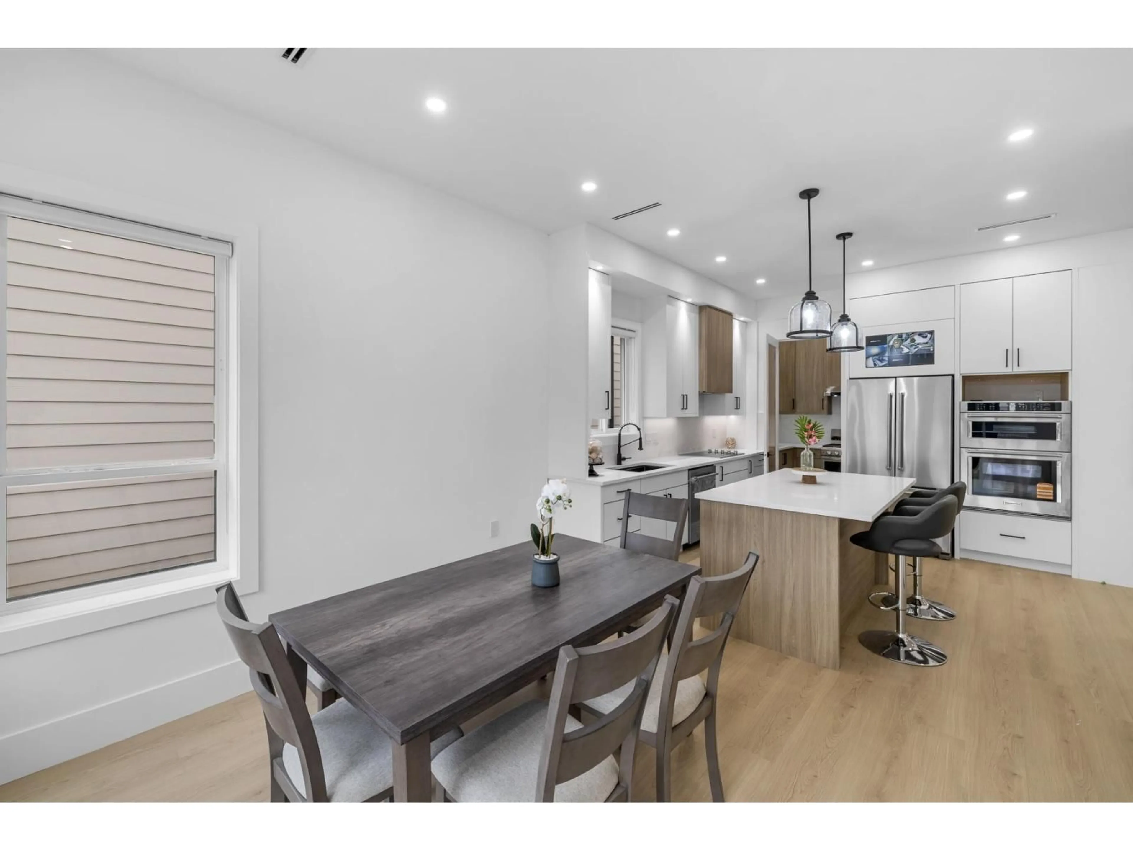 Open concept kitchen, wood/laminate floor for 14785 68A AVENUE, Surrey British Columbia V3S3C9