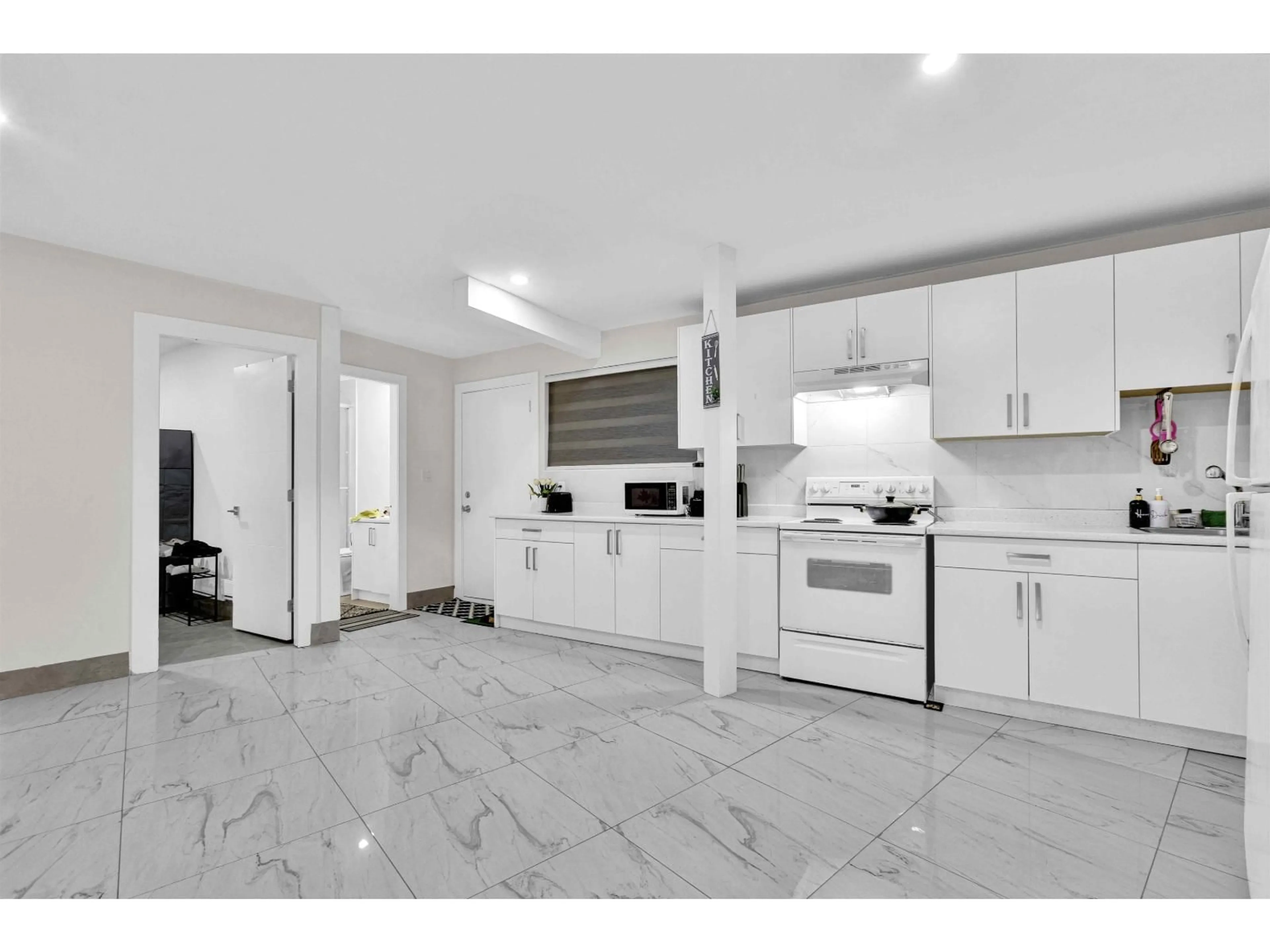 Open concept kitchen, ceramic/tile floor for 12943 112 AVENUE, Surrey British Columbia V3T2S6