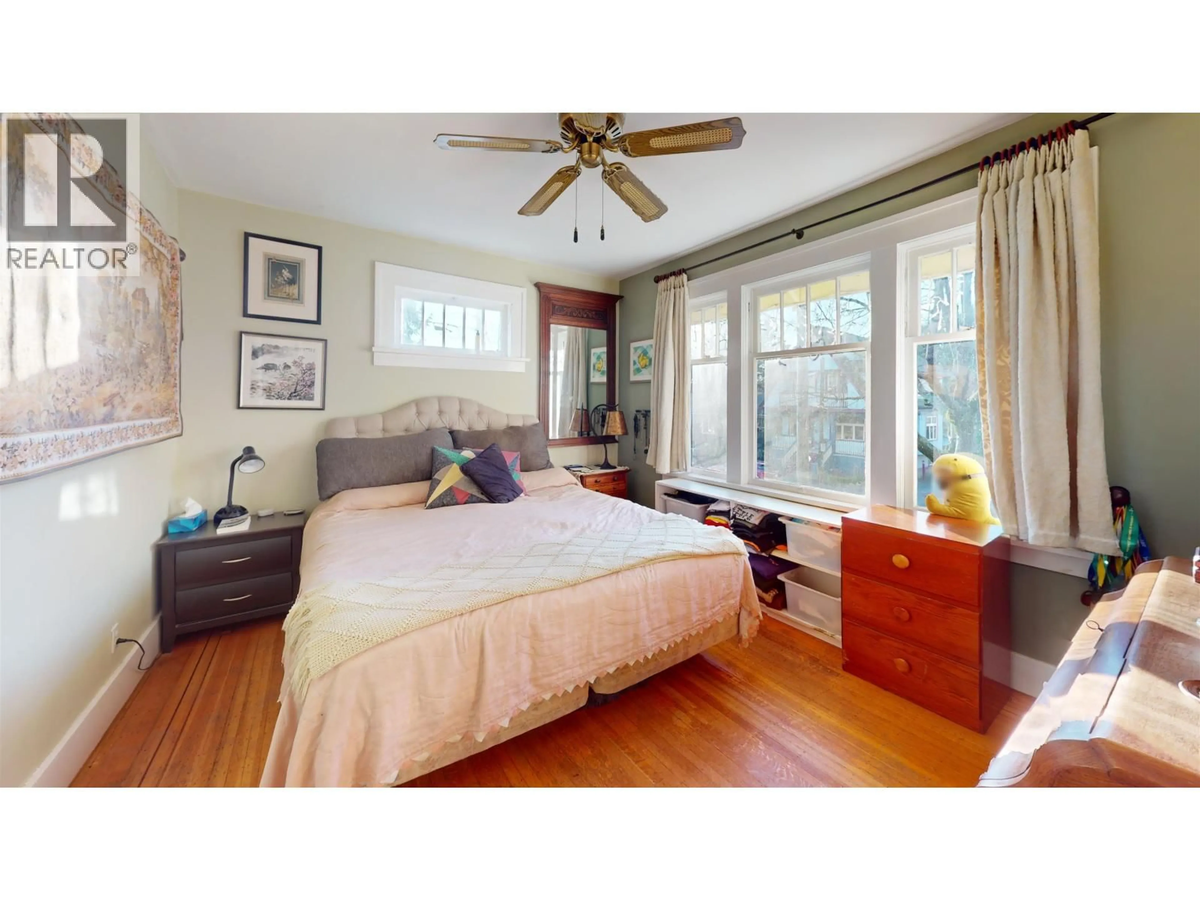 Bedroom with bed, wood/laminate floor for 2340 VICTORIA DRIVE, Vancouver British Columbia V5N4K9