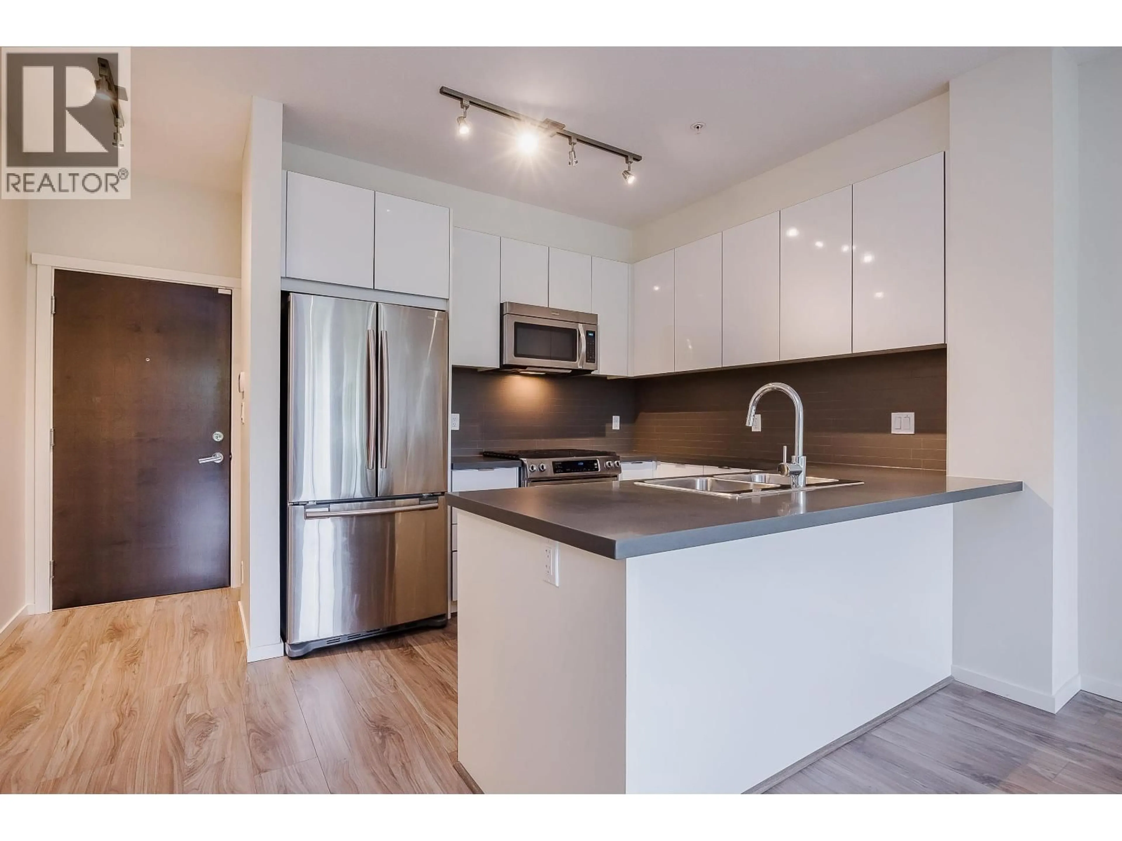 Open concept kitchen, wood/laminate floor for 103 - 1135 WINDSOR MEWS, Coquitlam British Columbia V3B0L2