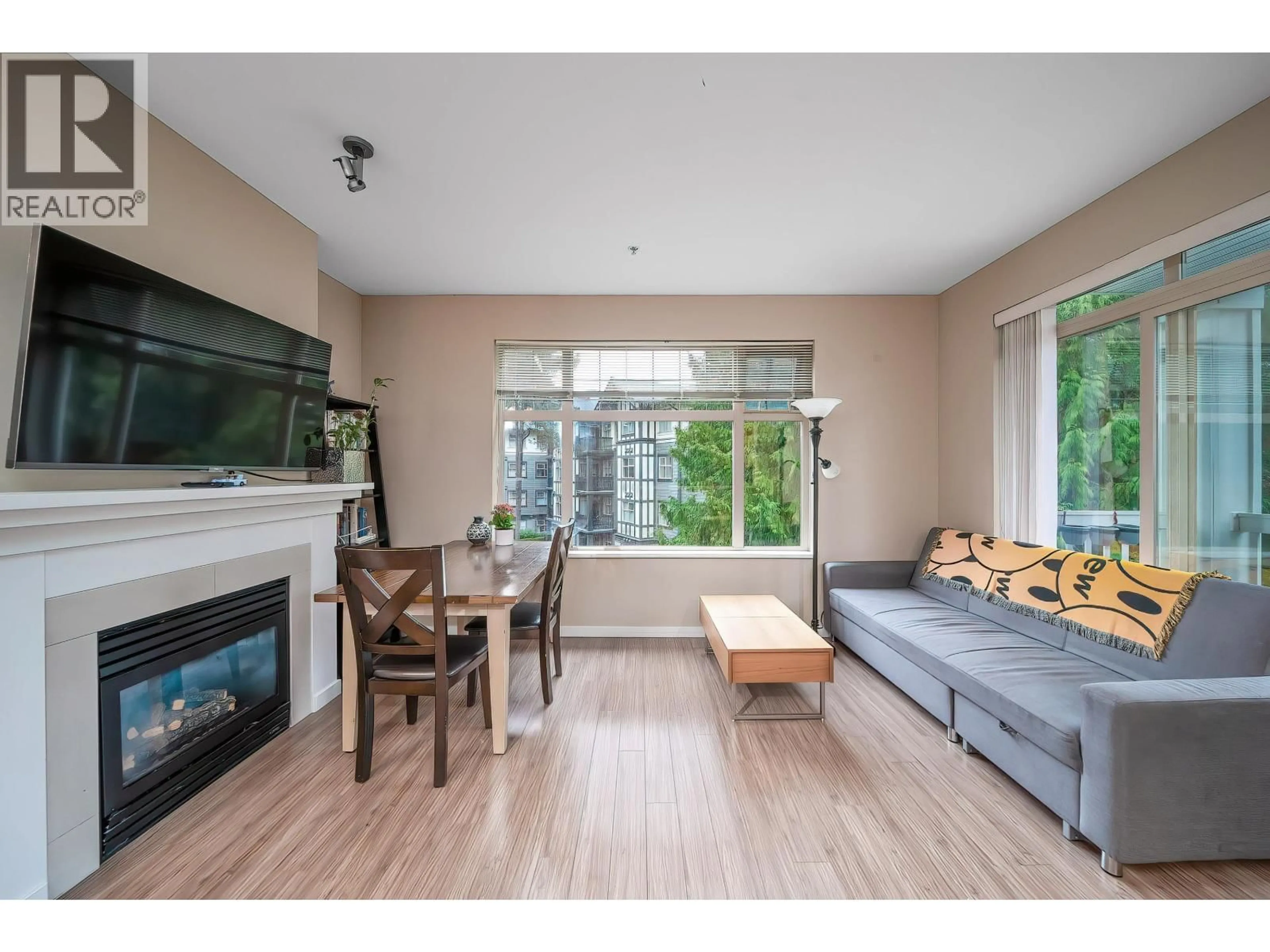 Living room with furniture, wood/laminate floor for 313 - 4883 MACLURE MEWS, Vancouver British Columbia V6J5M8