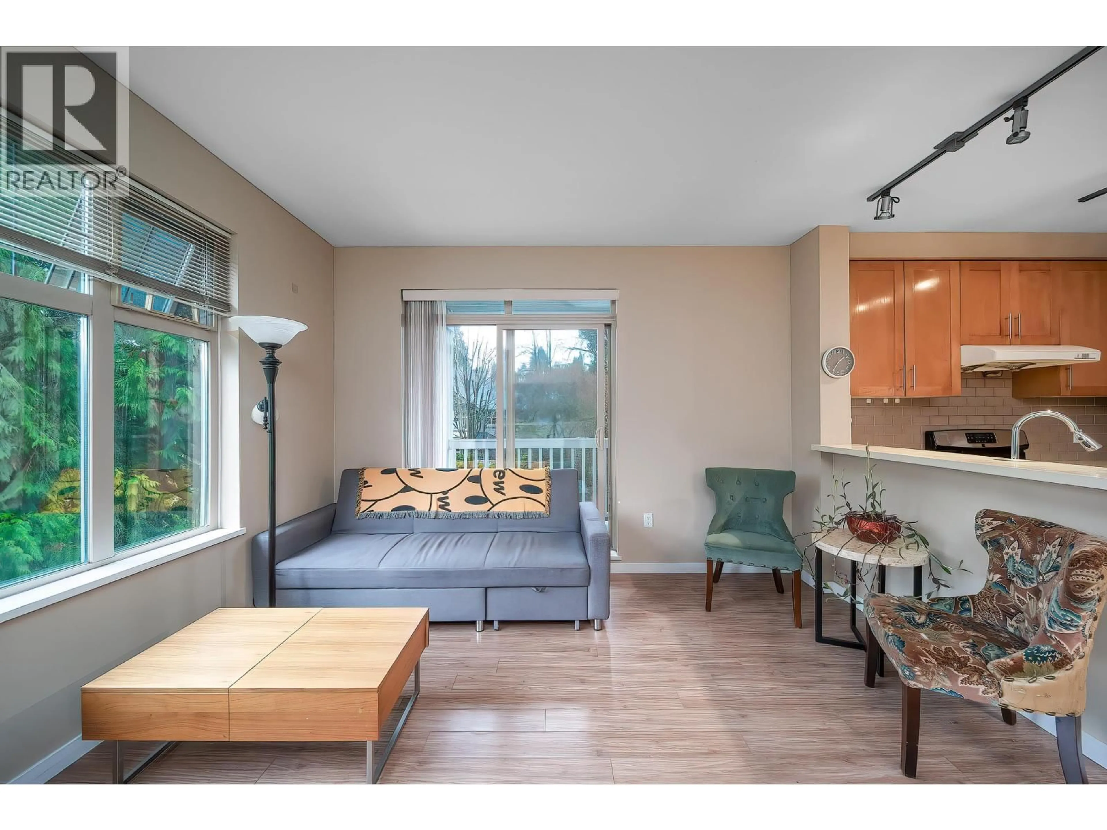 Living room with furniture, wood/laminate floor for 313 - 4883 MACLURE MEWS, Vancouver British Columbia V6J5M8