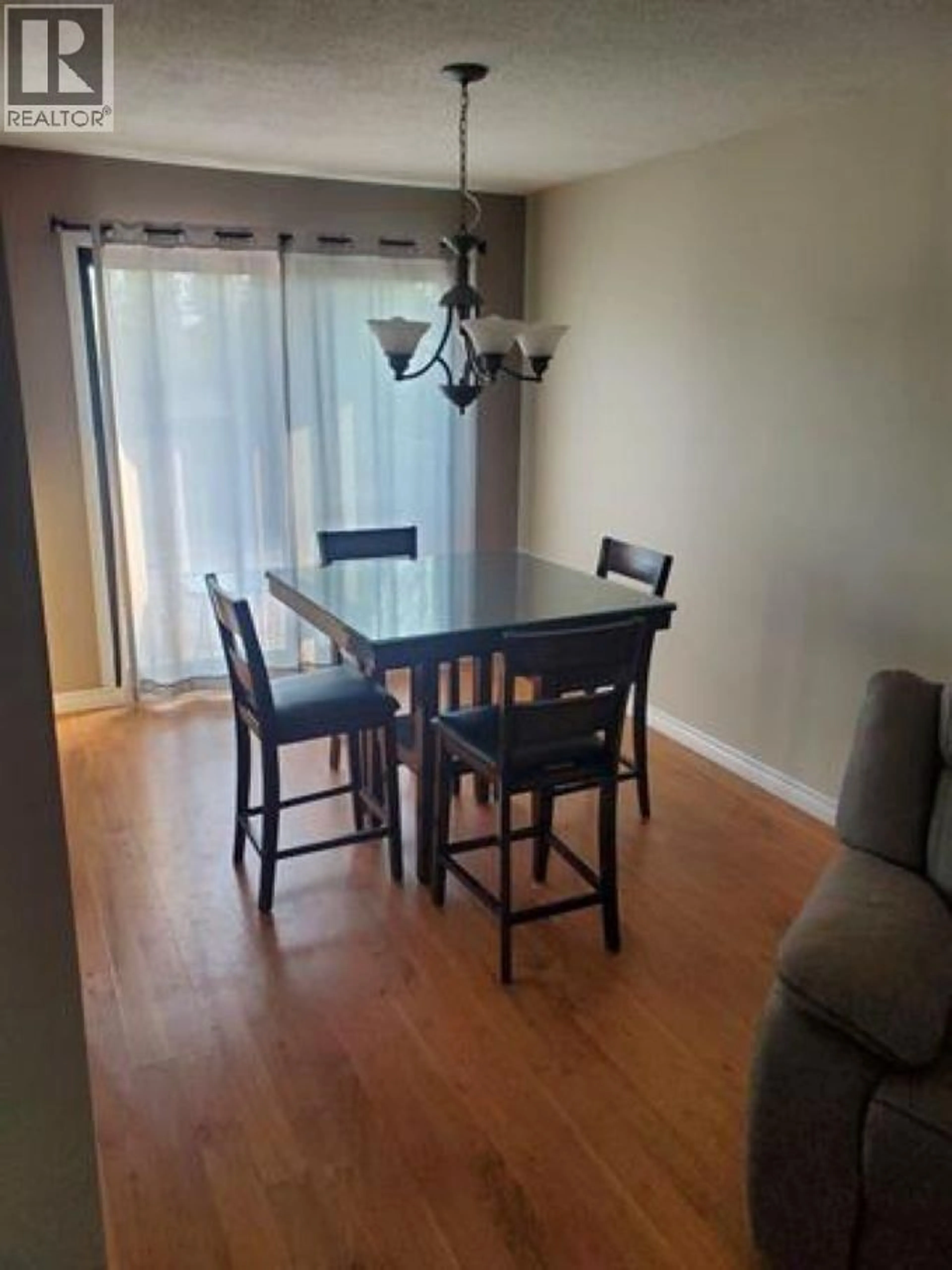 Dining room, wood/laminate floor for 27 MANSON CRESCENT, Mackenzie British Columbia V0J2C0