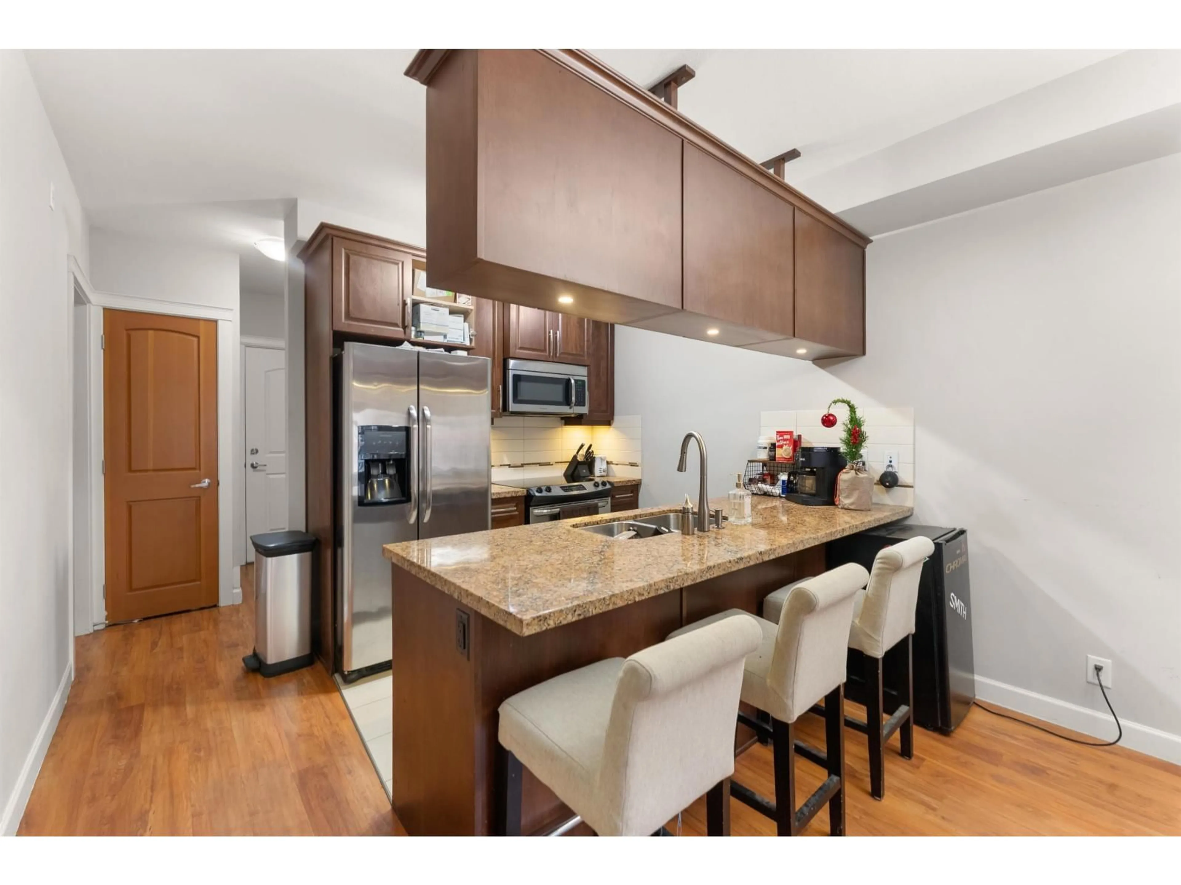 Open concept kitchen, wood/laminate floor for 251 - 8328 207A STREET, Langley British Columbia V2Y0K5