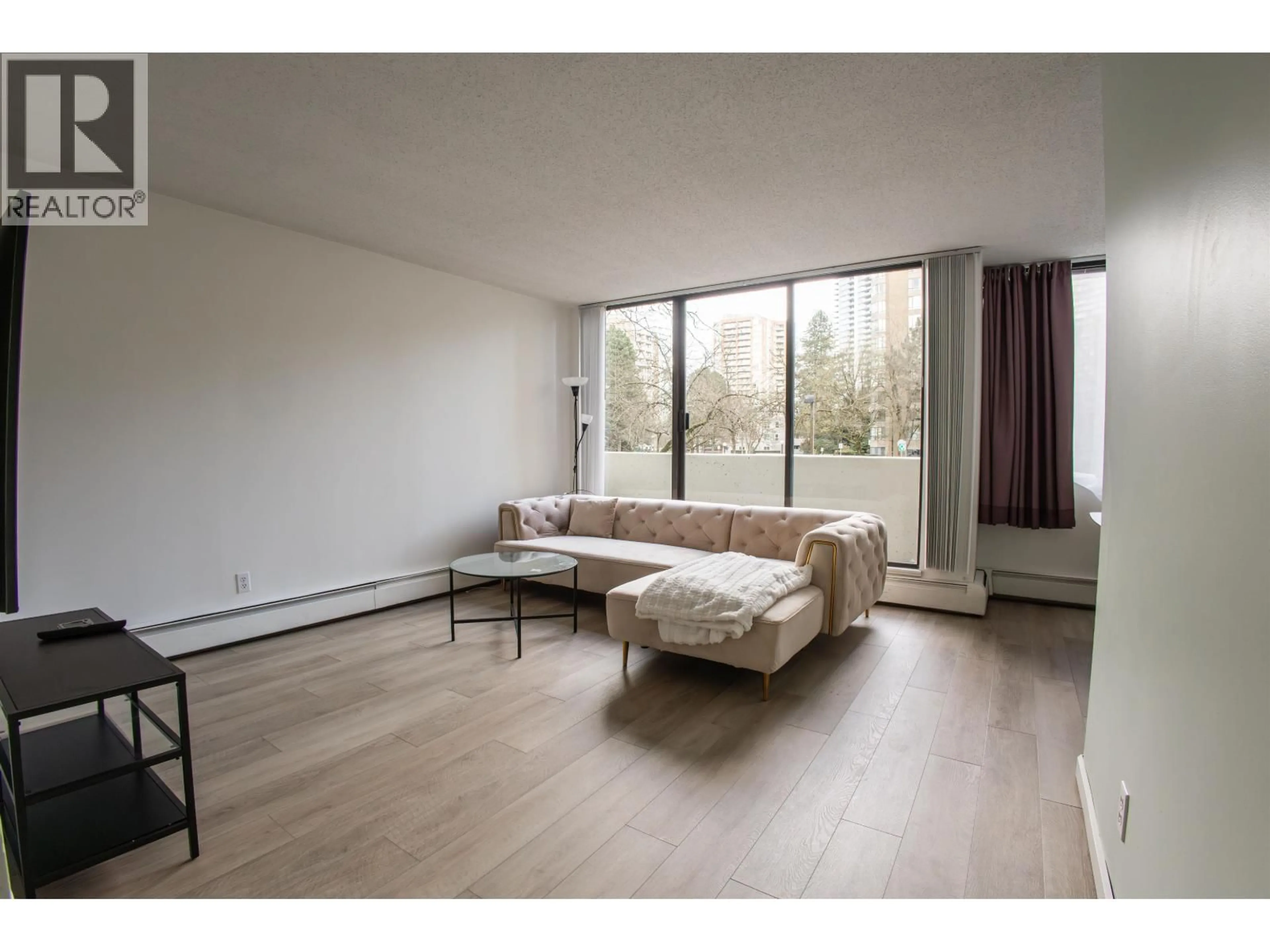 Living room with furniture, unknown for 204 - 4200 MAYBERRY STREET, Burnaby British Columbia V5H4A7