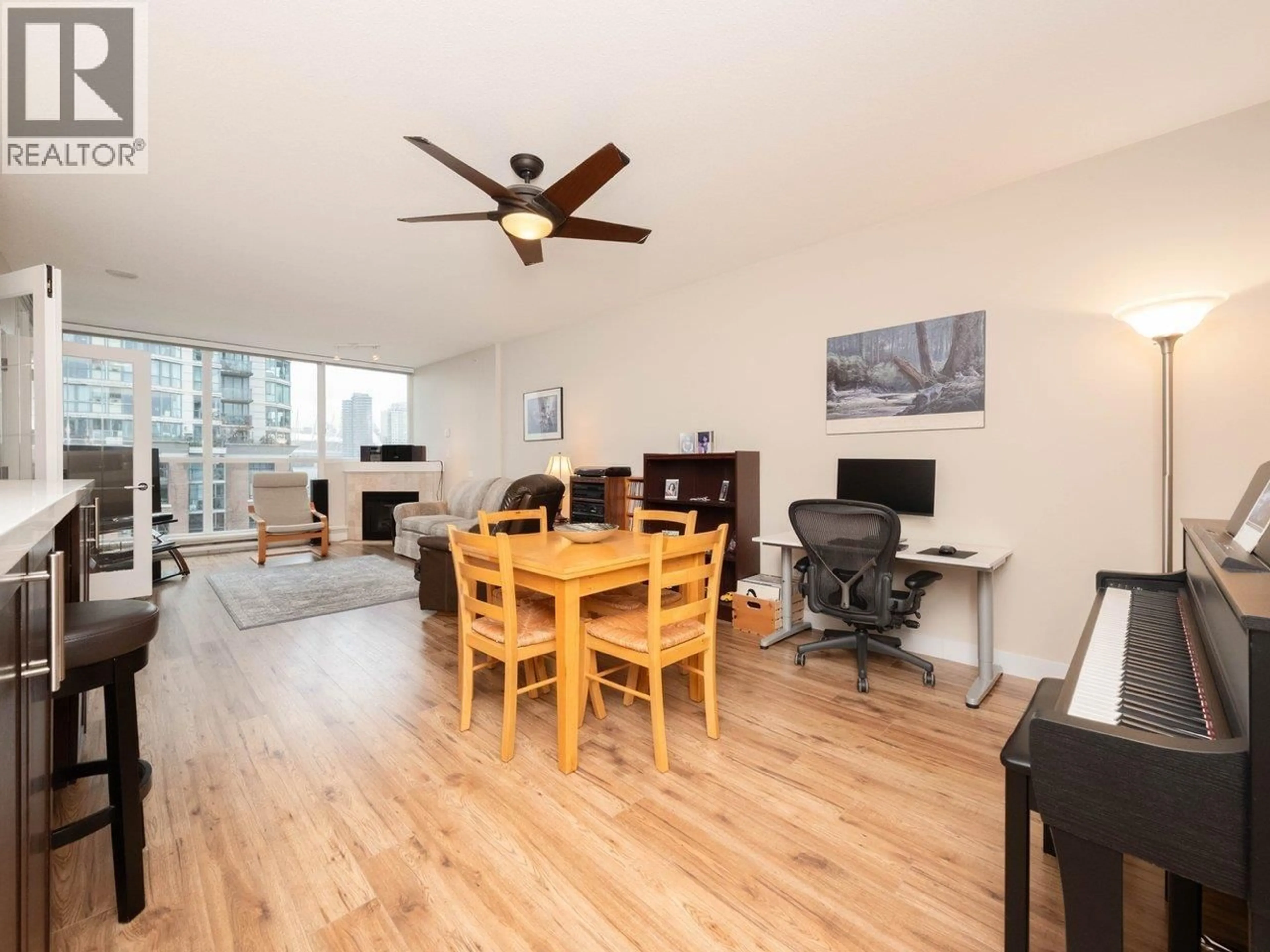 Living room with furniture, wood/laminate floor for 706 - 189 NATIONAL AVENUE, Vancouver British Columbia V6A4L8