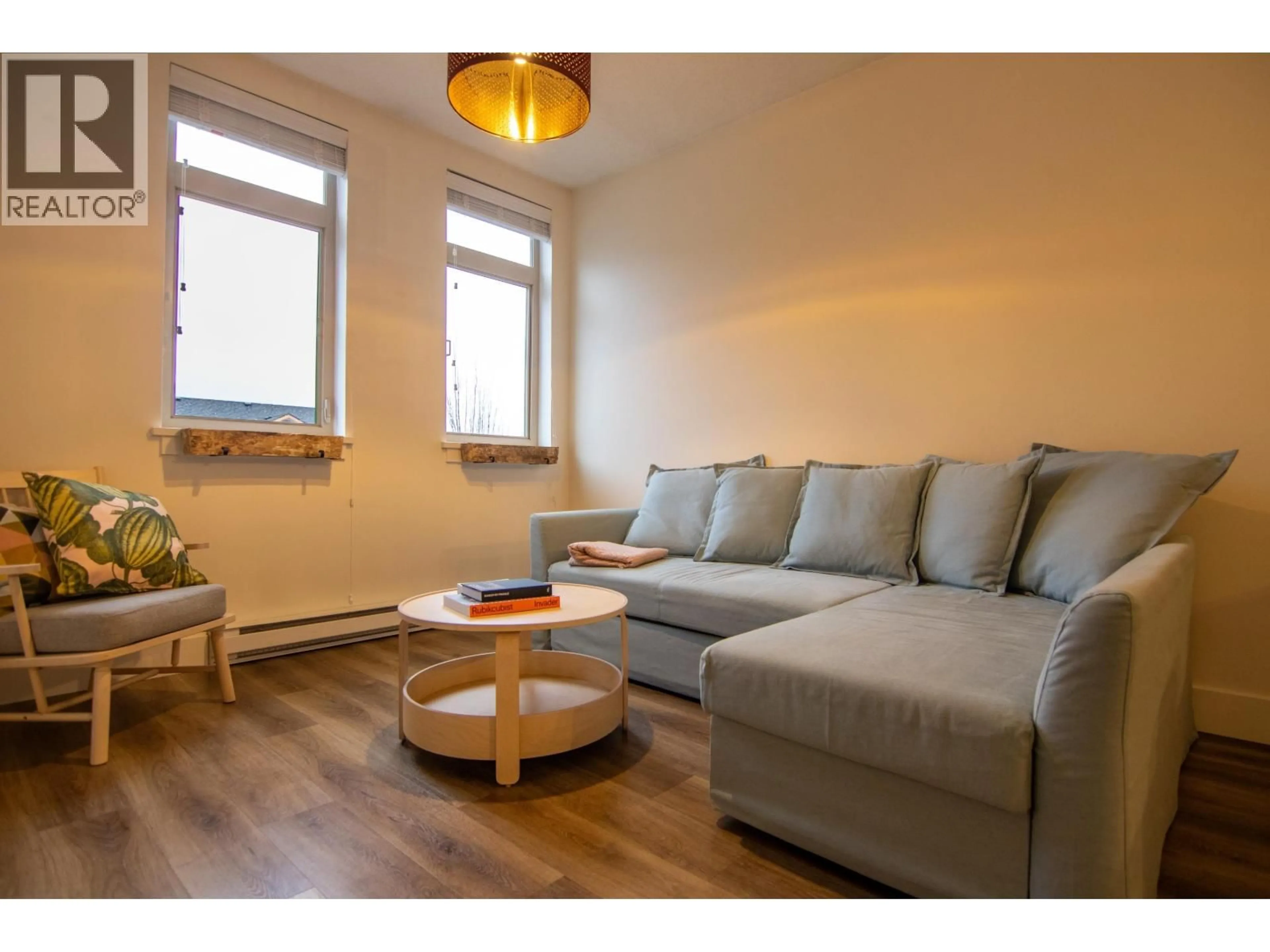 Living room with furniture, wood/laminate floor for 305 - 7330 ARBUTUS STREET, Pemberton British Columbia V0N2L1