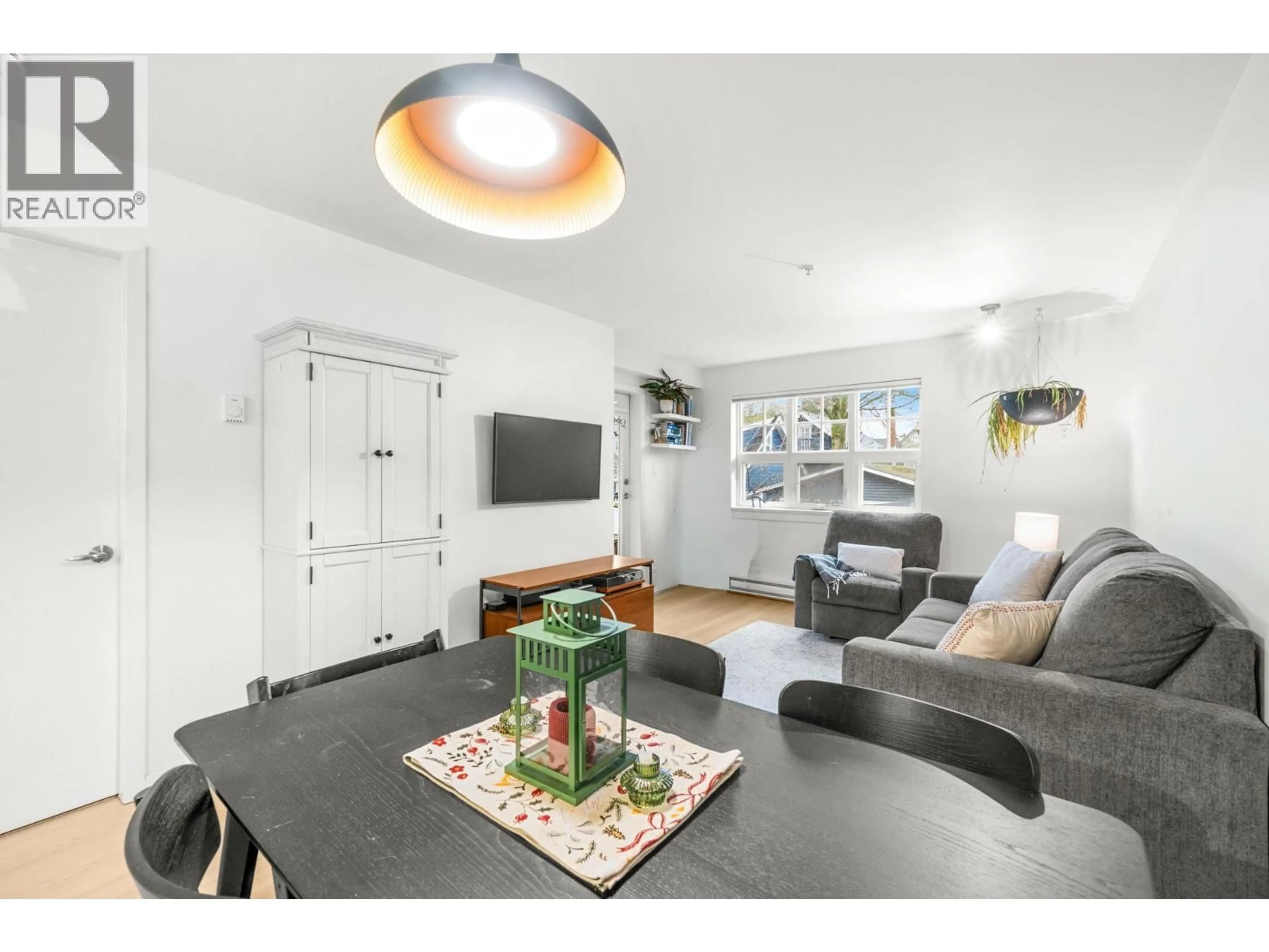 Living room with furniture, wood/laminate floor for 203 - 930 16TH AVENUE, Vancouver British Columbia V5Z1T2