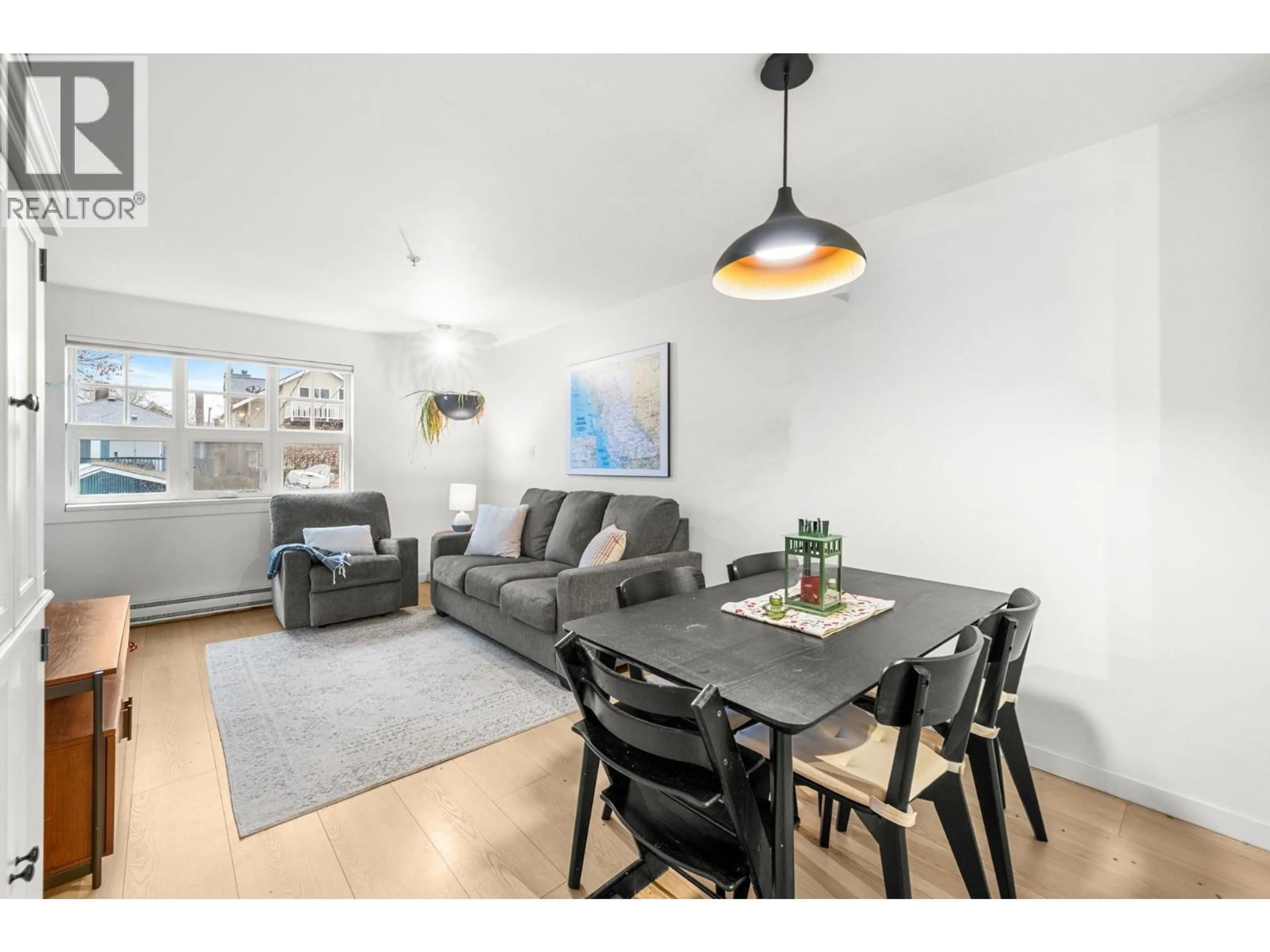 Living room with furniture, wood/laminate floor for 203 - 930 16TH AVENUE, Vancouver British Columbia V5Z1T2