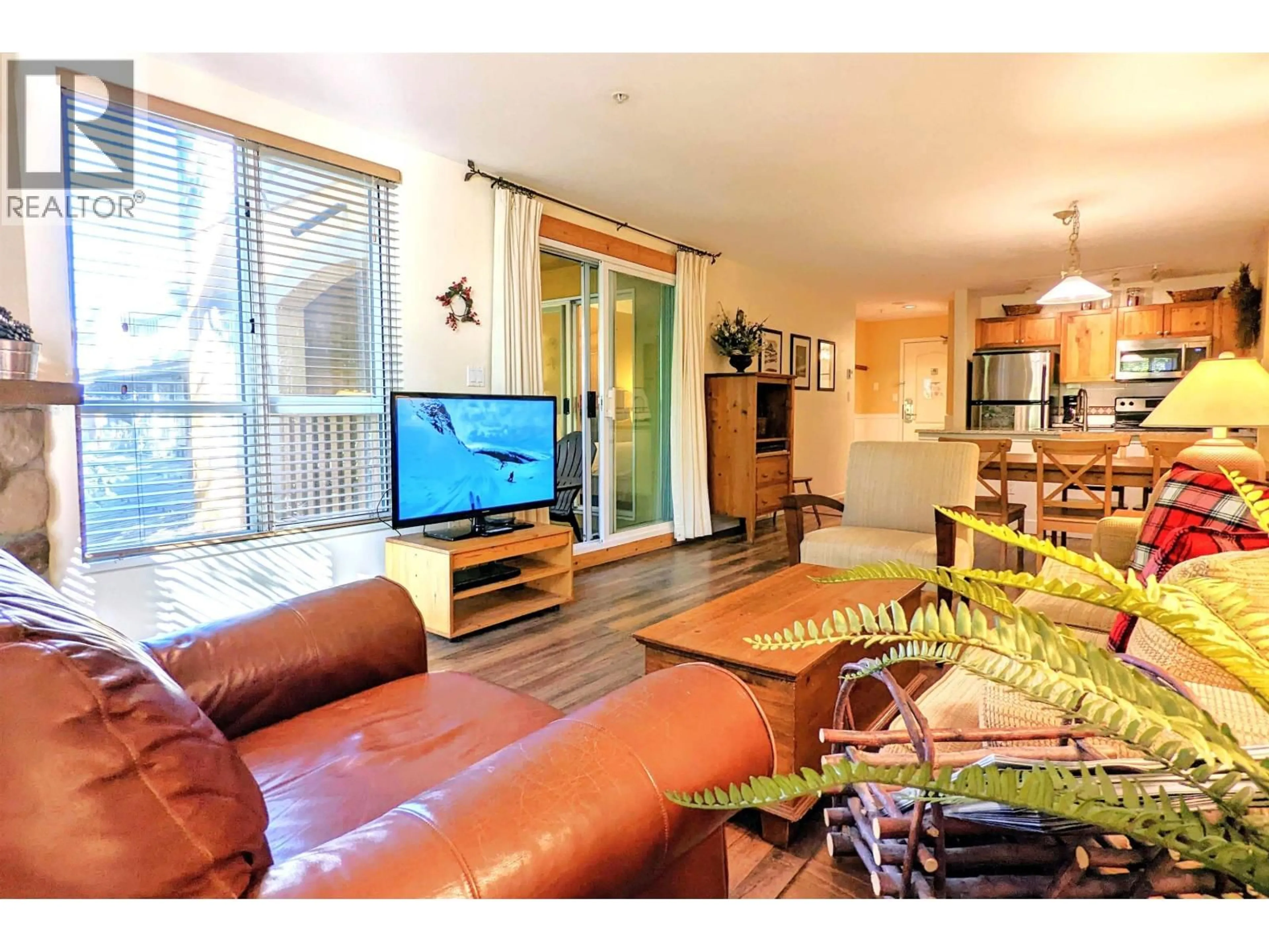 Living room with furniture, wood/laminate floor for 311 - 4314 MAIN STREET, Whistler British Columbia V8E1A8