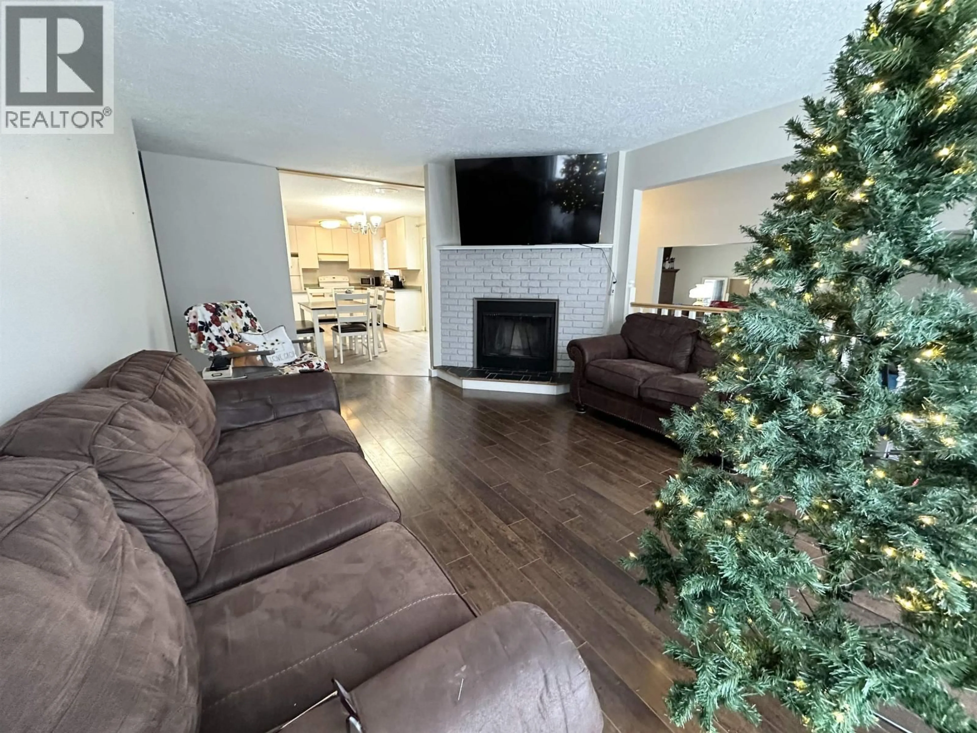 Living room with furniture, unknown for 10708 104 AVENUE, Fort St. John British Columbia V1J2L3