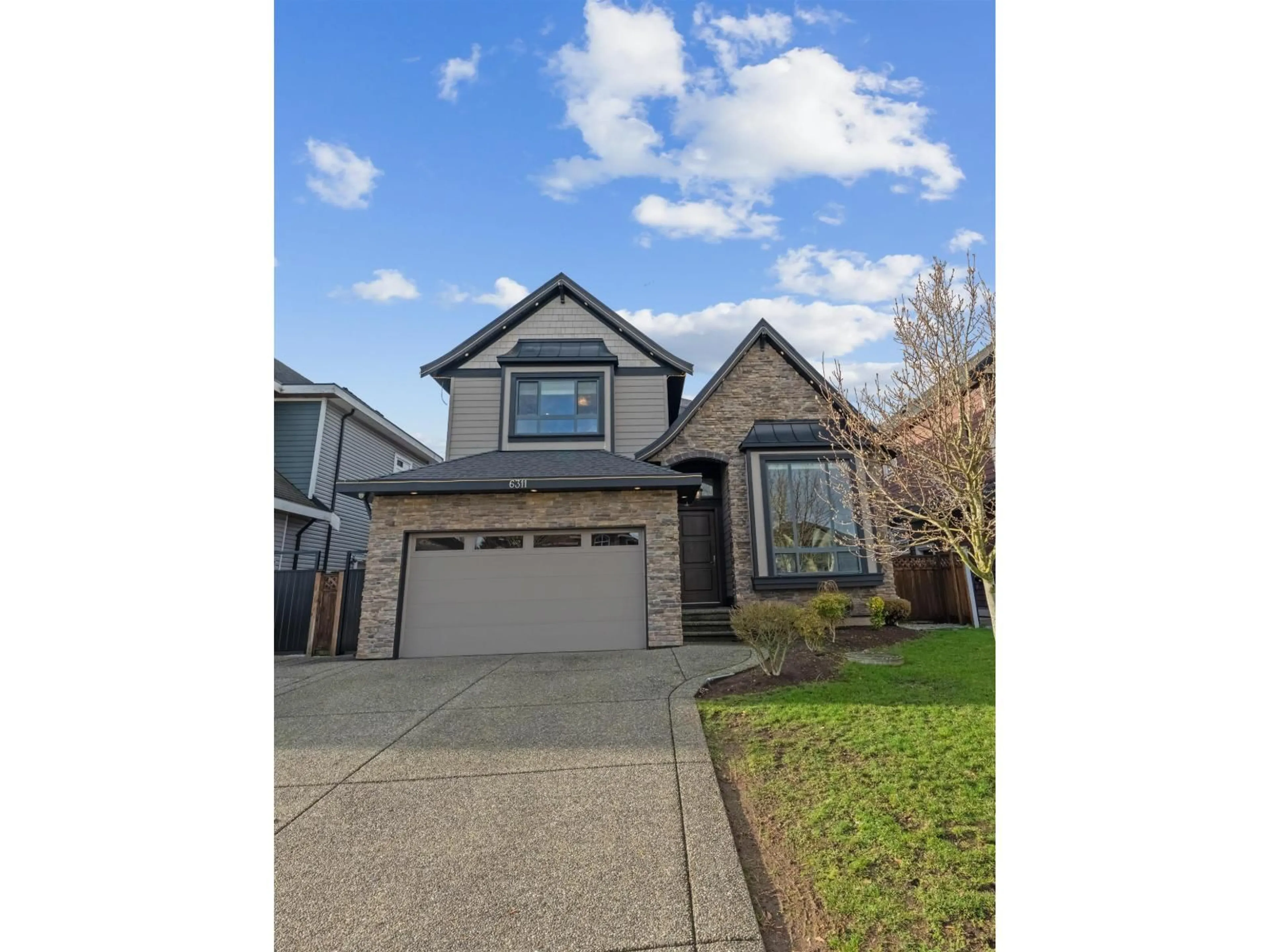 Home with vinyl exterior material, street for 6311 128A STREET, Surrey British Columbia V3X3L9