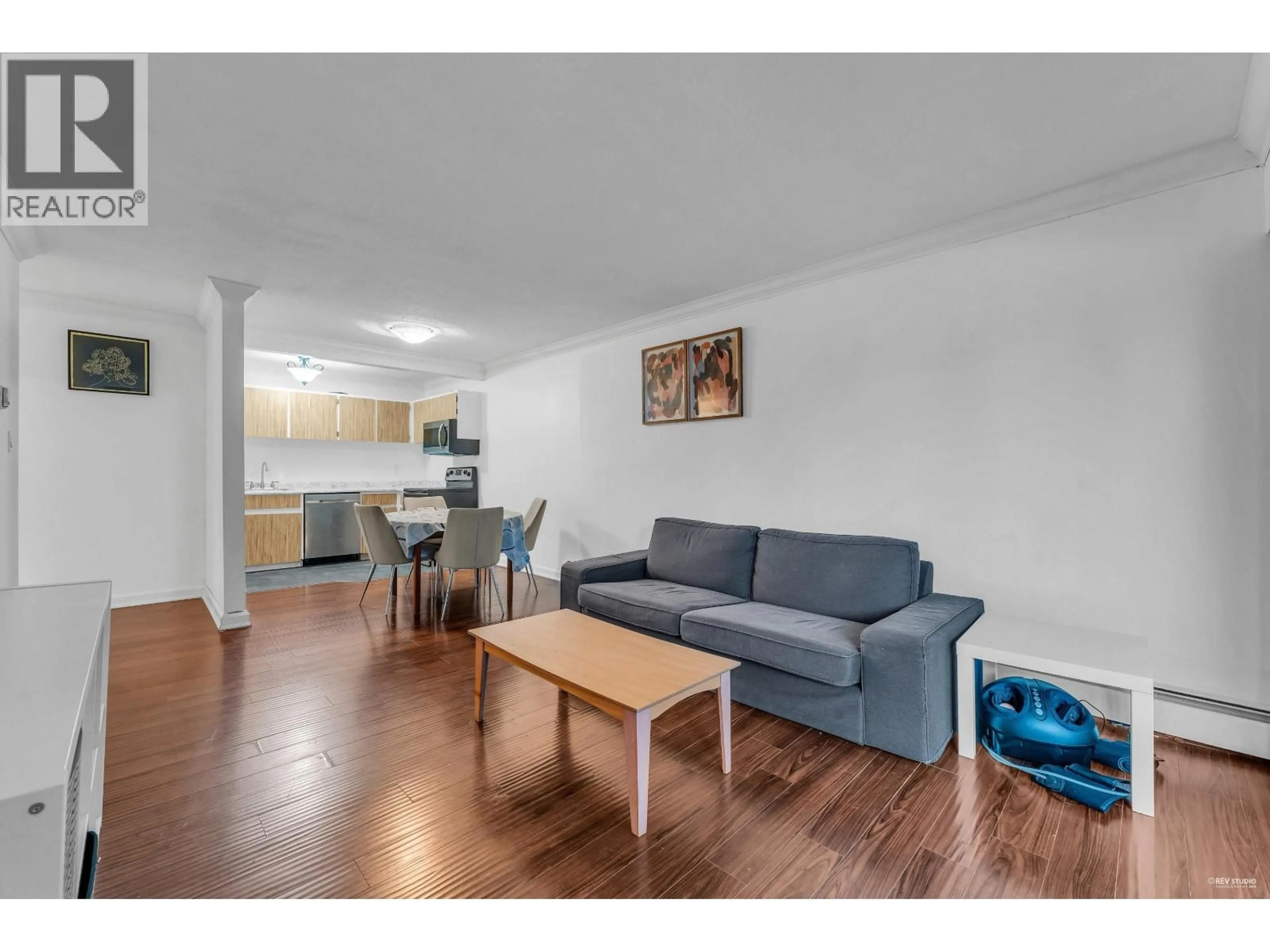 Living room with furniture, wood/laminate floor for 308 - 601 NORTH ROAD, Coquitlam British Columbia V3J1P1