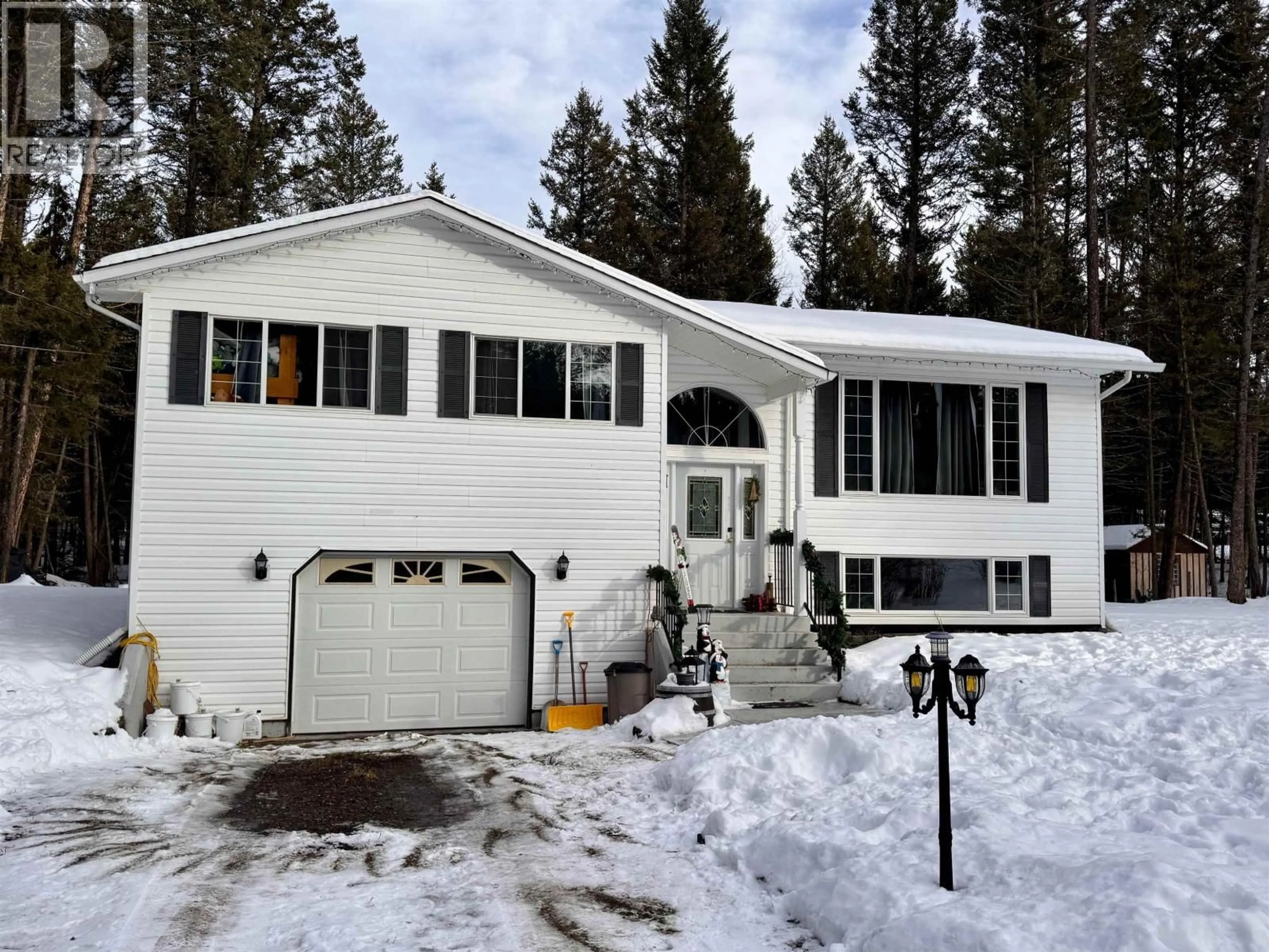 Home with vinyl exterior material, street for 4983 SMITH ROAD, 108 Mile Ranch British Columbia V0K2Z0