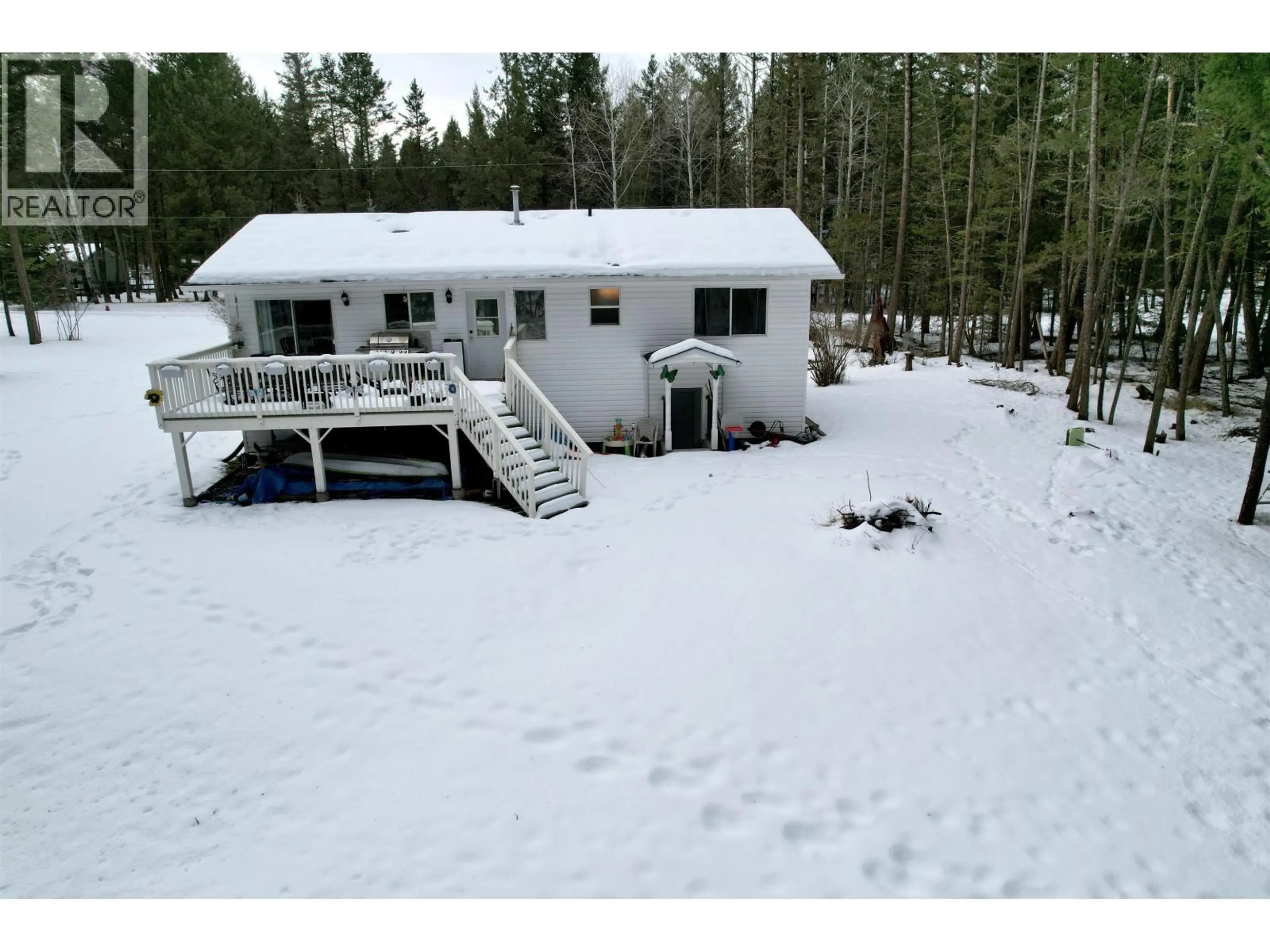 A pic from outside/outdoor area/front of a property/back of a property/a pic from drone, unknown for 4983 SMITH ROAD, 108 Mile Ranch British Columbia V0K2Z0