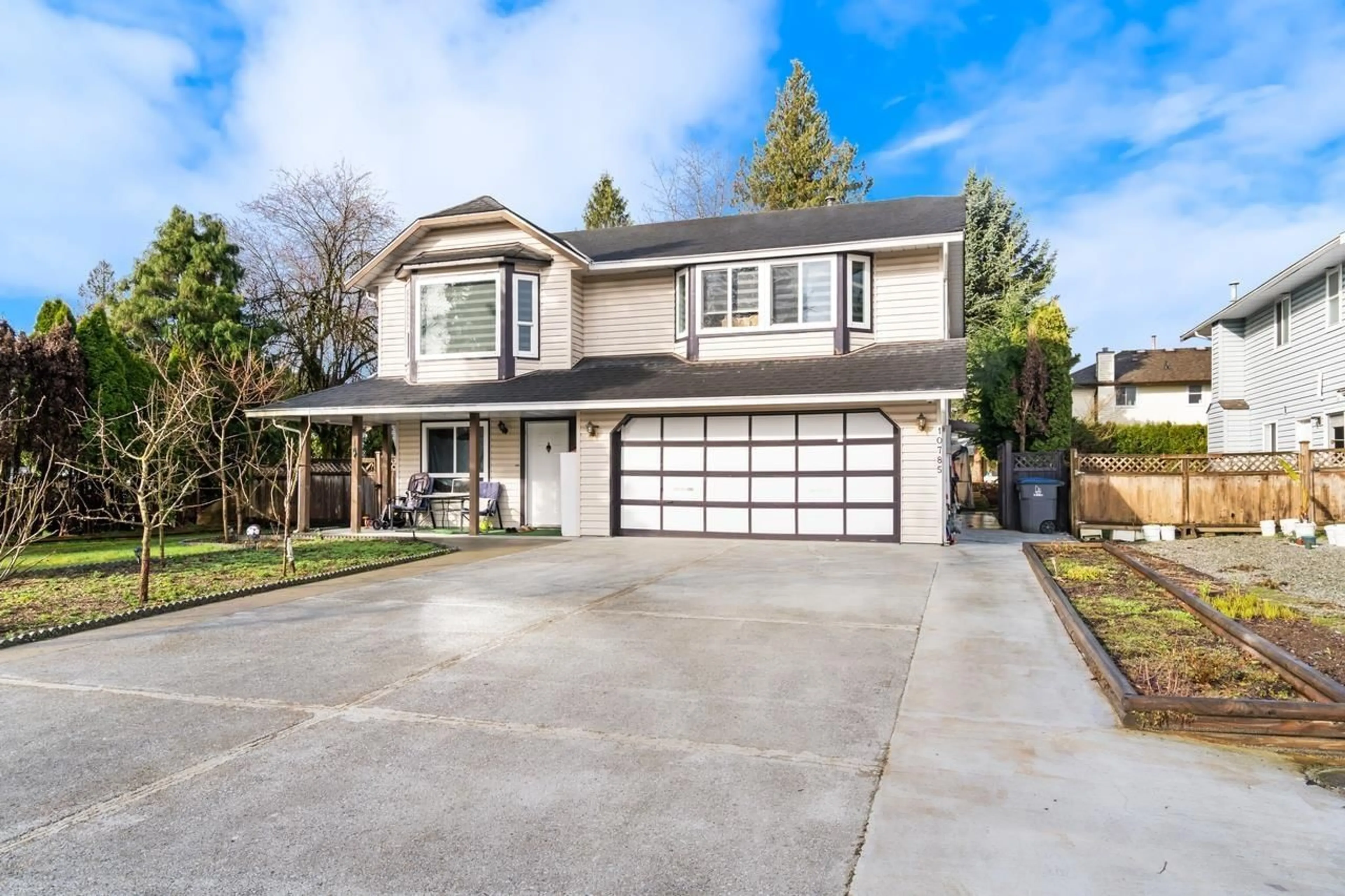 Home with vinyl exterior material, street for 10785 155A STREET, Surrey British Columbia V3R9X5