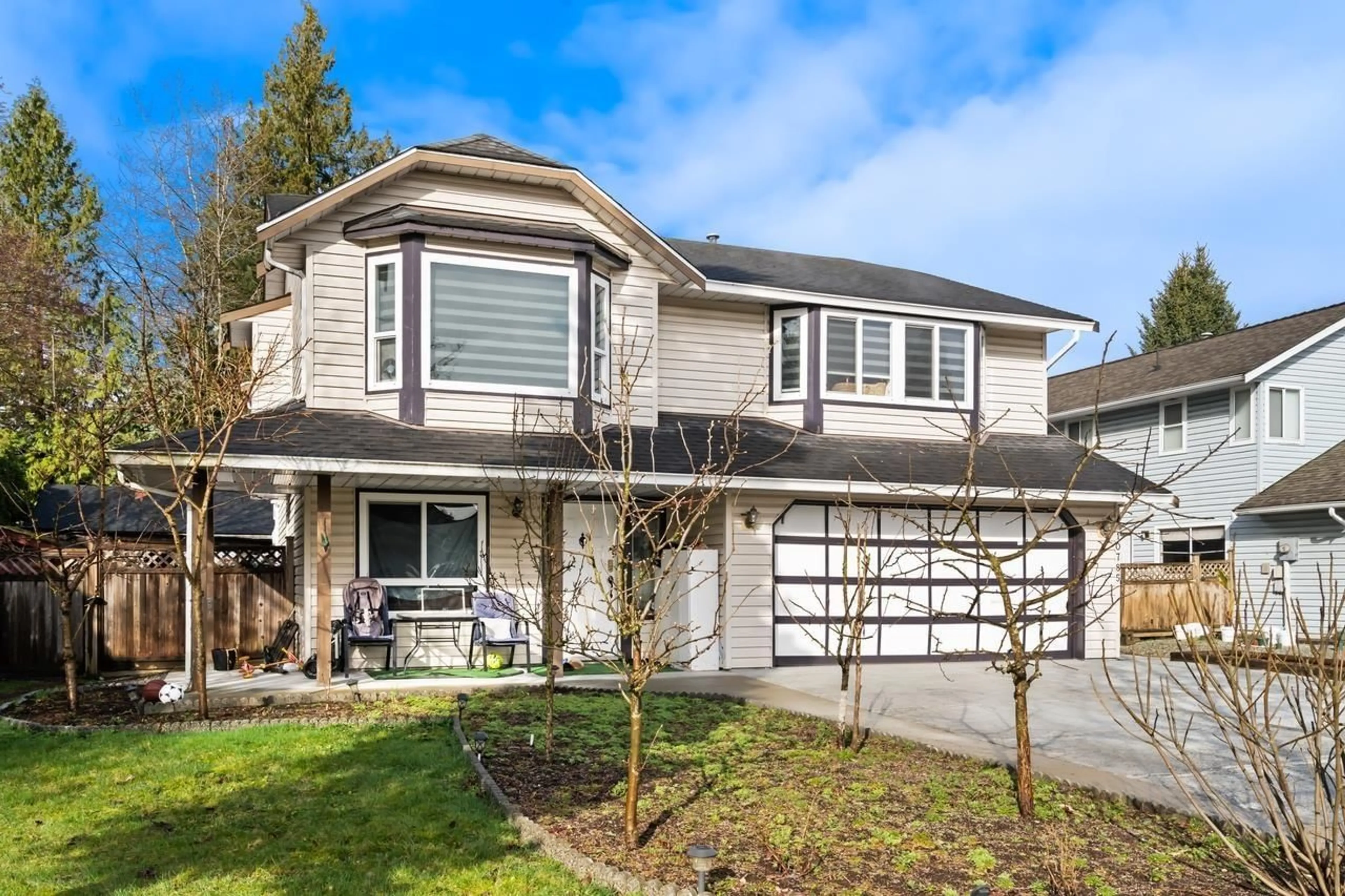 Home with vinyl exterior material, street for 10785 155A STREET, Surrey British Columbia V3R9X5