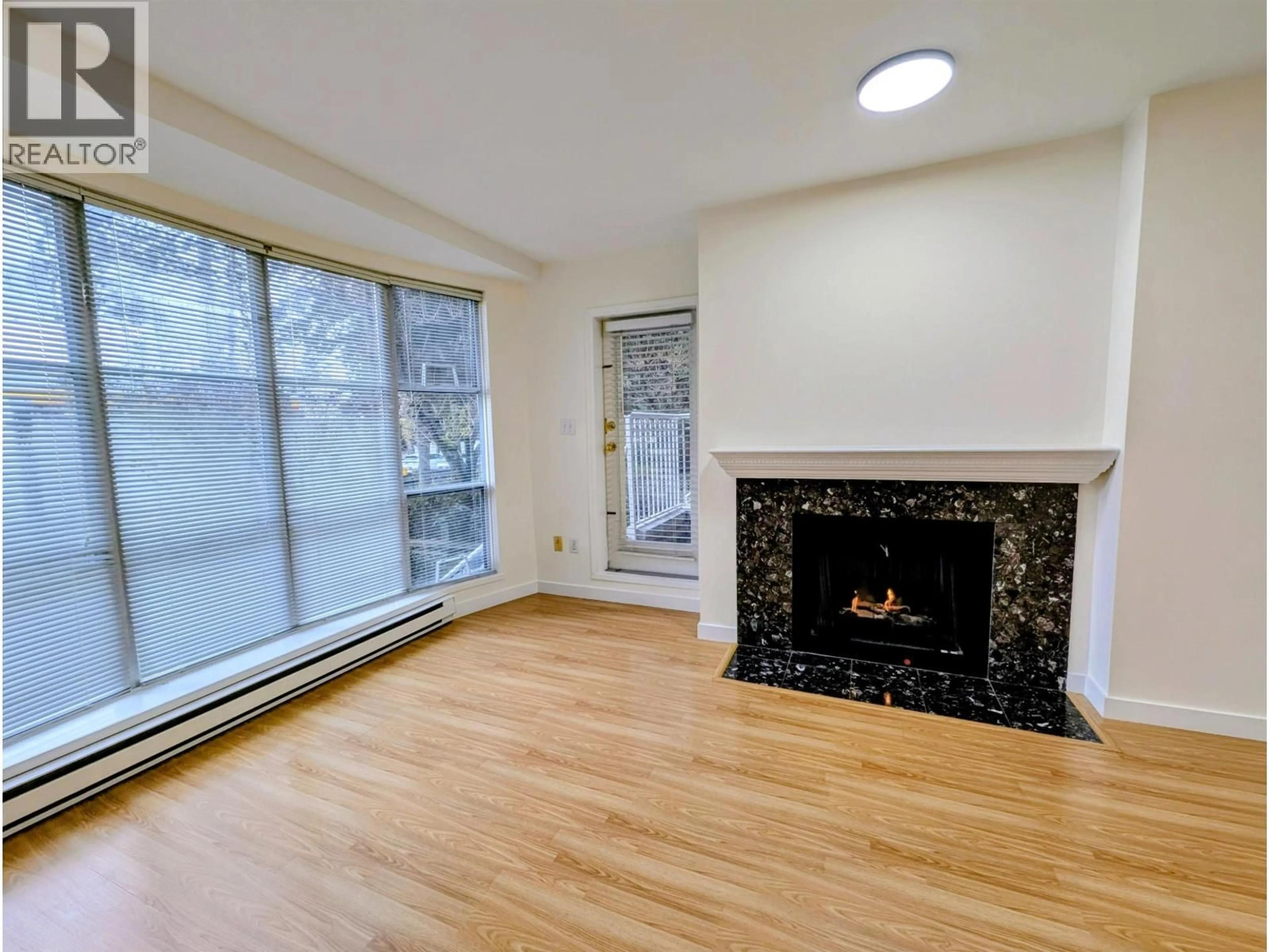 Living room with furniture, wood/laminate floor for 108 - 5488 ARCADIA ROAD, Richmond British Columbia V6X2G9