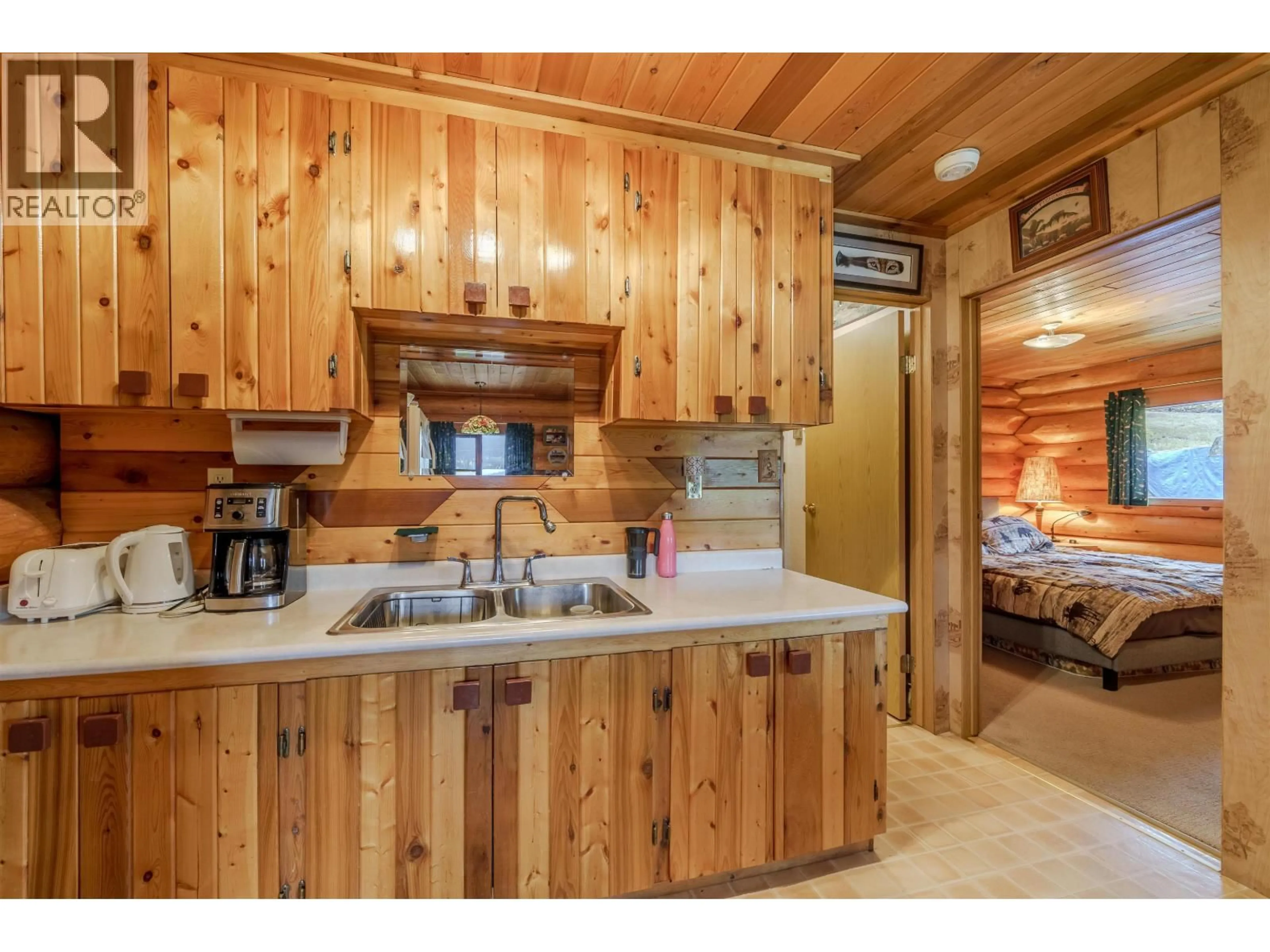 Standard kitchen, wood/laminate floor for 7561 MCCARTHY ROAD, Bridge Lake British Columbia V0K1X2