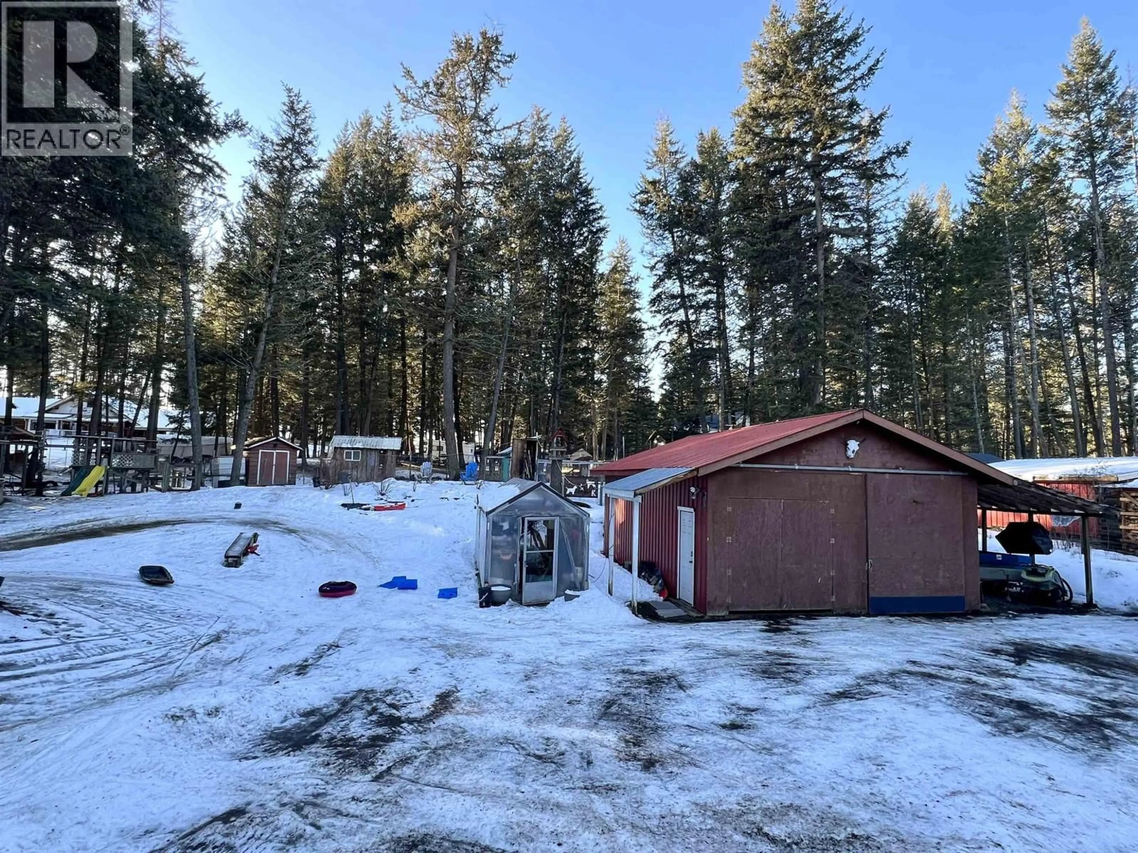 A pic from outside/outdoor area/front of a property/back of a property/a pic from drone, forest/trees view for 5047 EASZEE DRIVE, 108 Mile Ranch British Columbia V0K2Z0