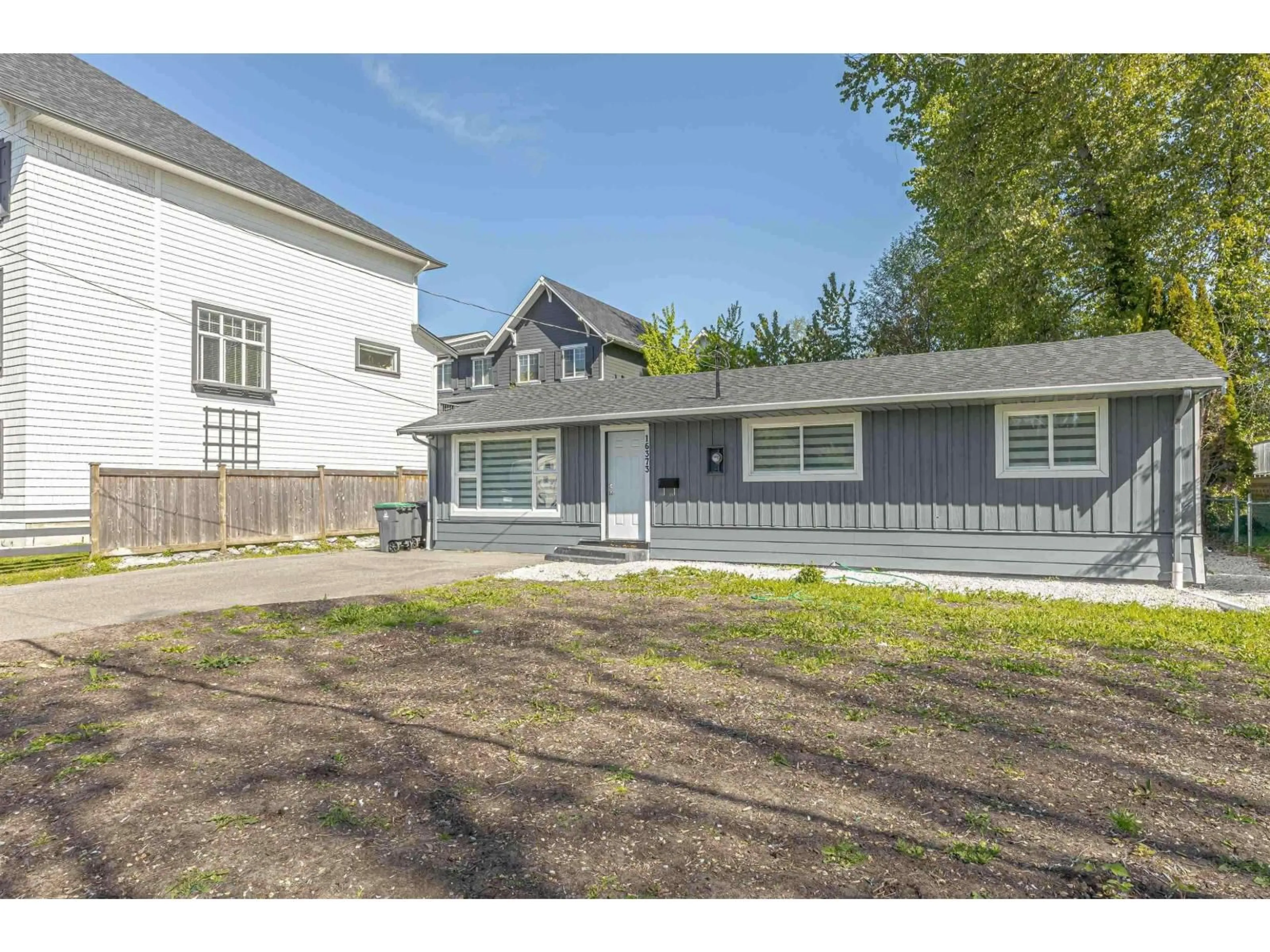 A pic from outside/outdoor area/front of a property/back of a property/a pic from drone, street for 16373 15 AVENUE, Surrey British Columbia V4A1L4