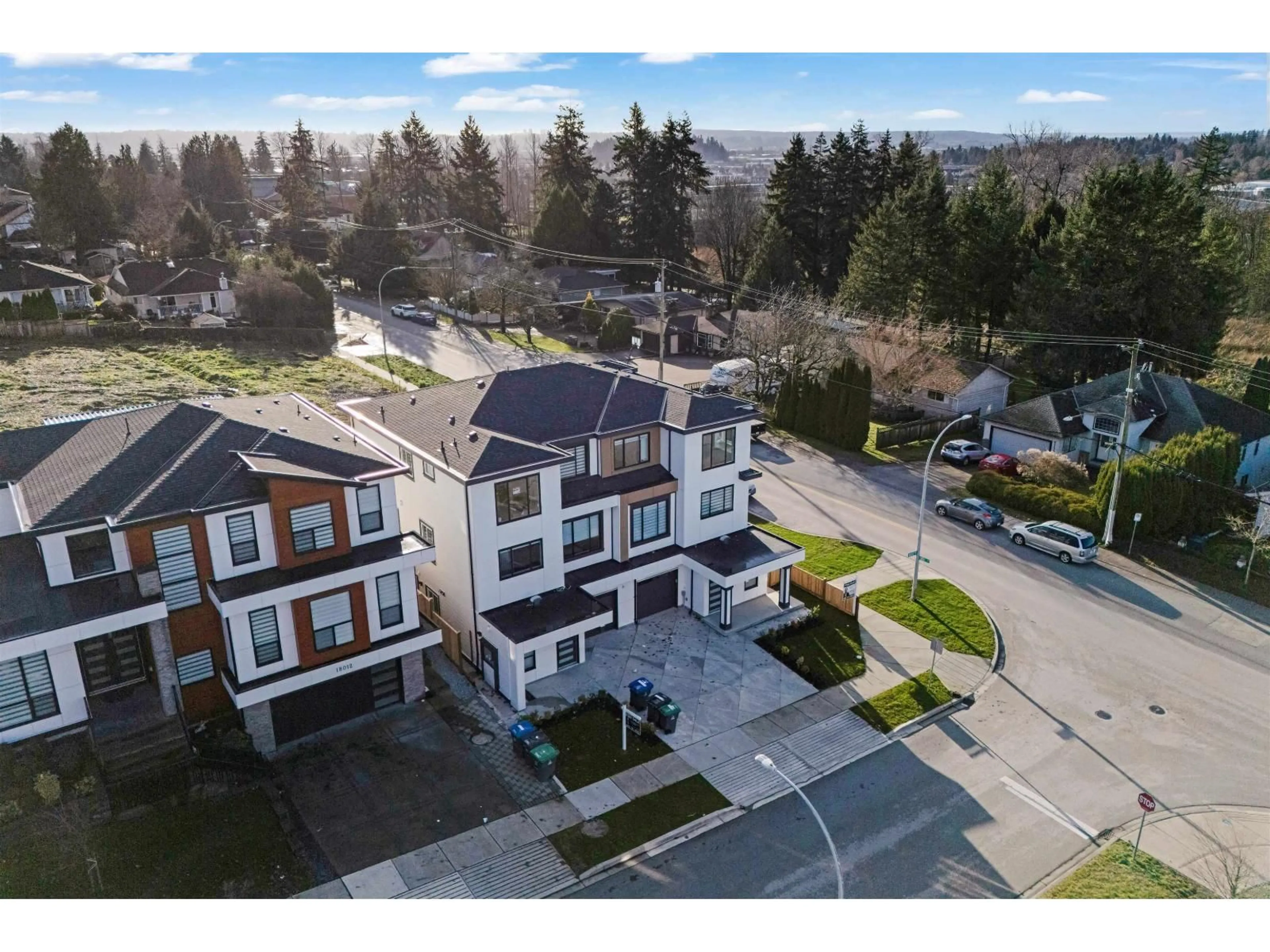 A pic from outside/outdoor area/front of a property/back of a property/a pic from drone, street for 101 - 18002 63B AVENUE, Surrey British Columbia V3S4G1