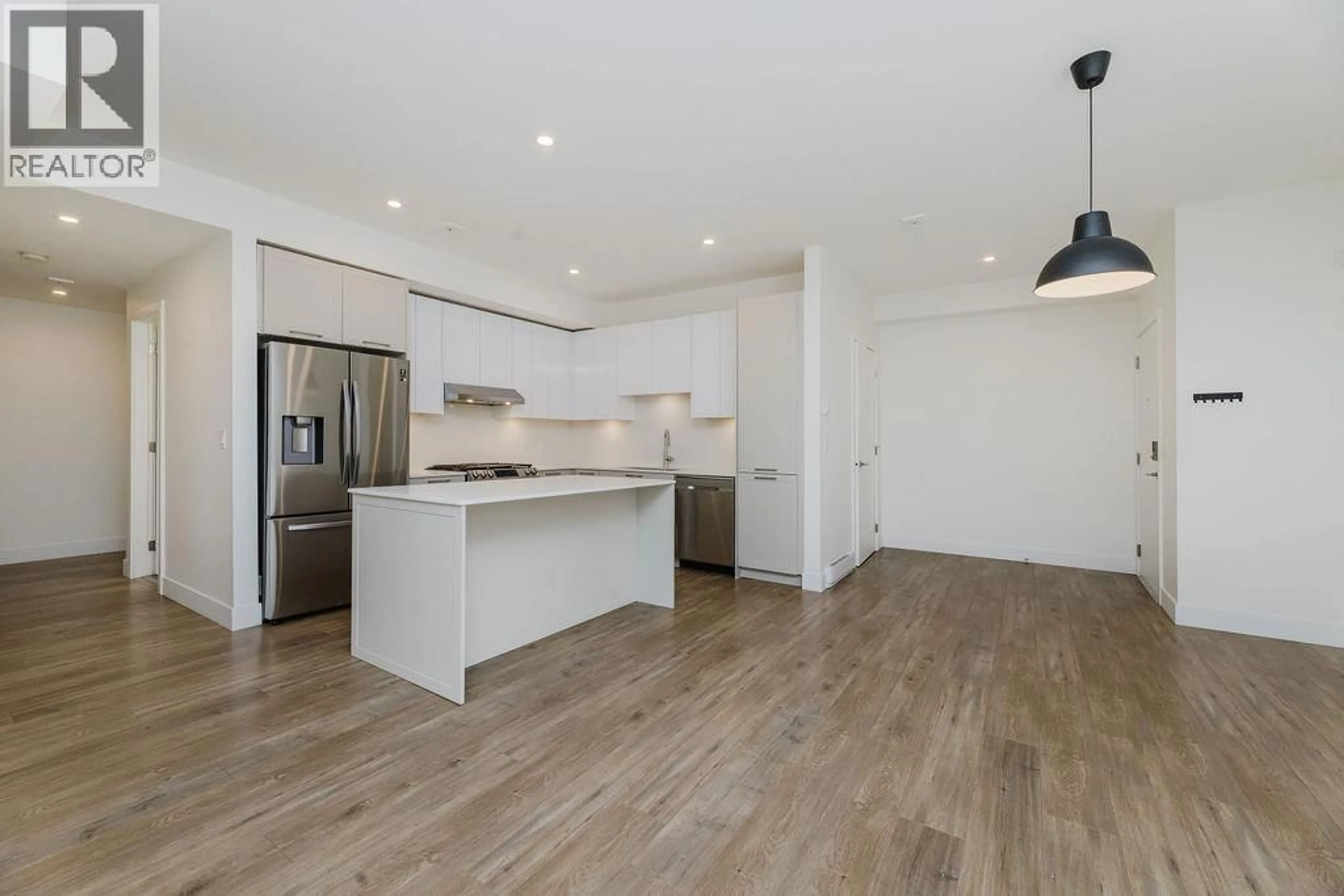 Open concept kitchen, wood/laminate floor for 102 - 710 SCHOOL ROAD, Gibsons British Columbia V0N1V9