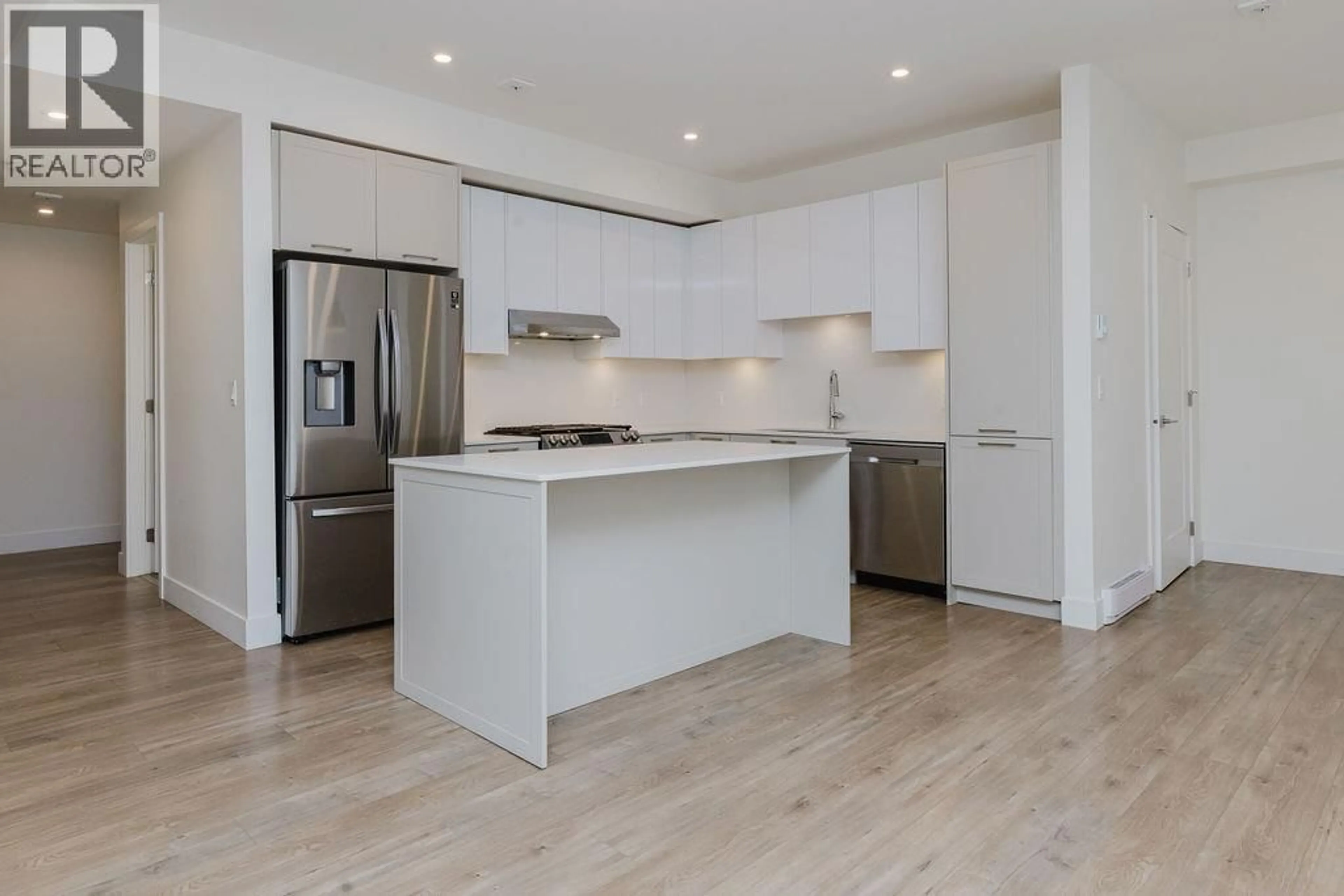 Open concept kitchen, wood/laminate floor for 102 - 710 SCHOOL ROAD, Gibsons British Columbia V0N1V9