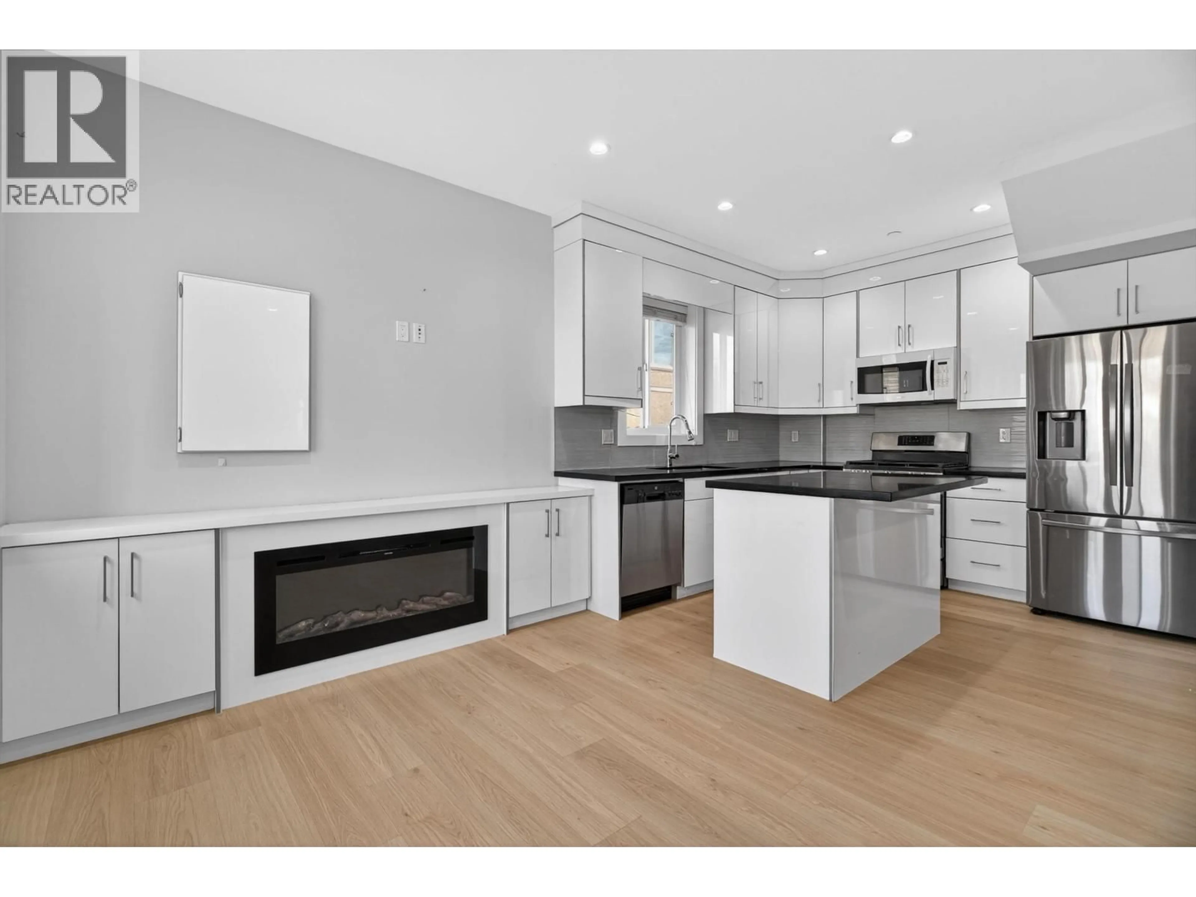 Open concept kitchen, wood/laminate floor for 2430 41 AVENUE, Vancouver British Columbia V5R2W4