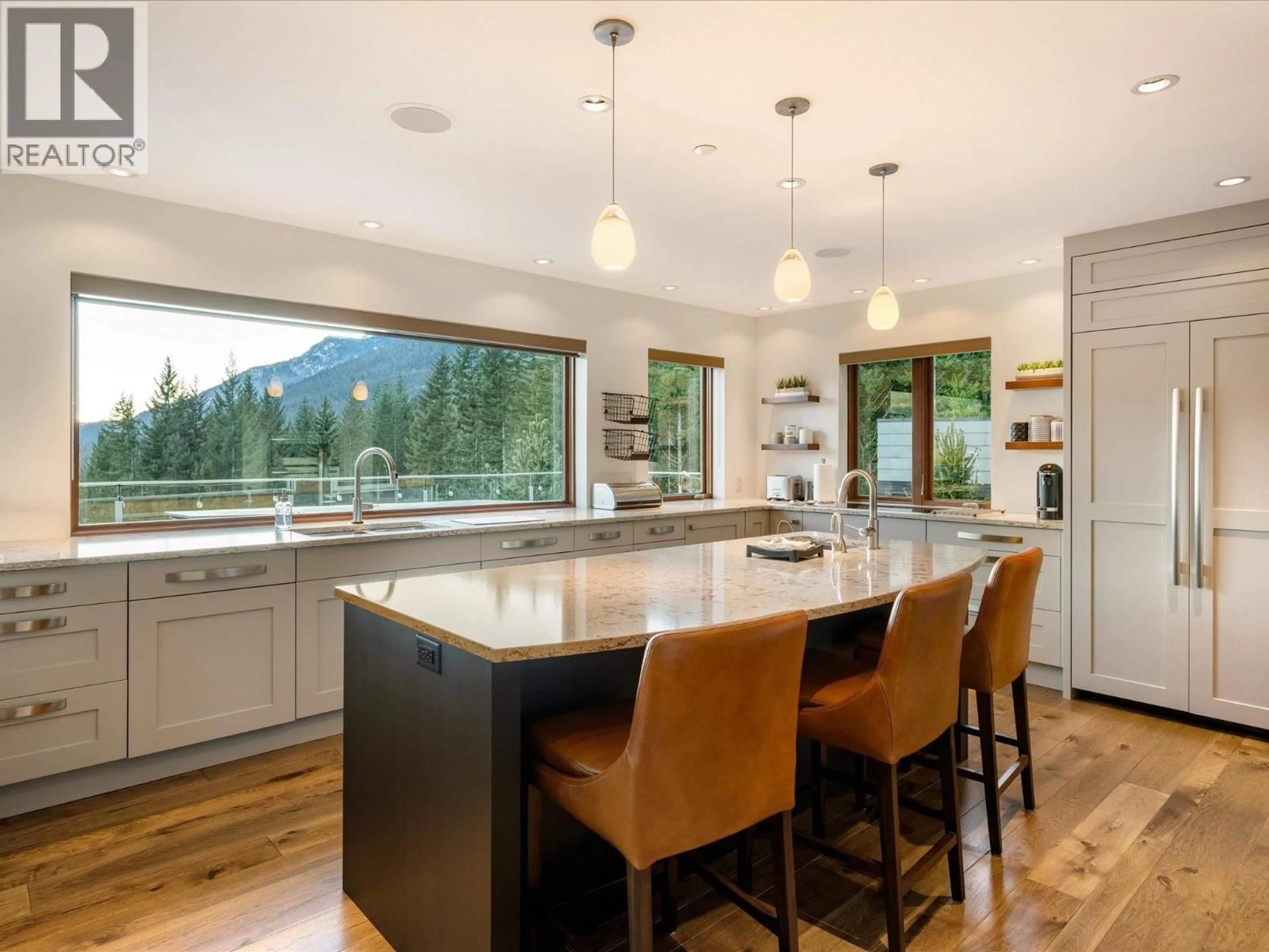Open concept kitchen, wood/laminate floor for 8529 ASHLEIGH MCIVOR DRIVE, Whistler British Columbia V8E1L9