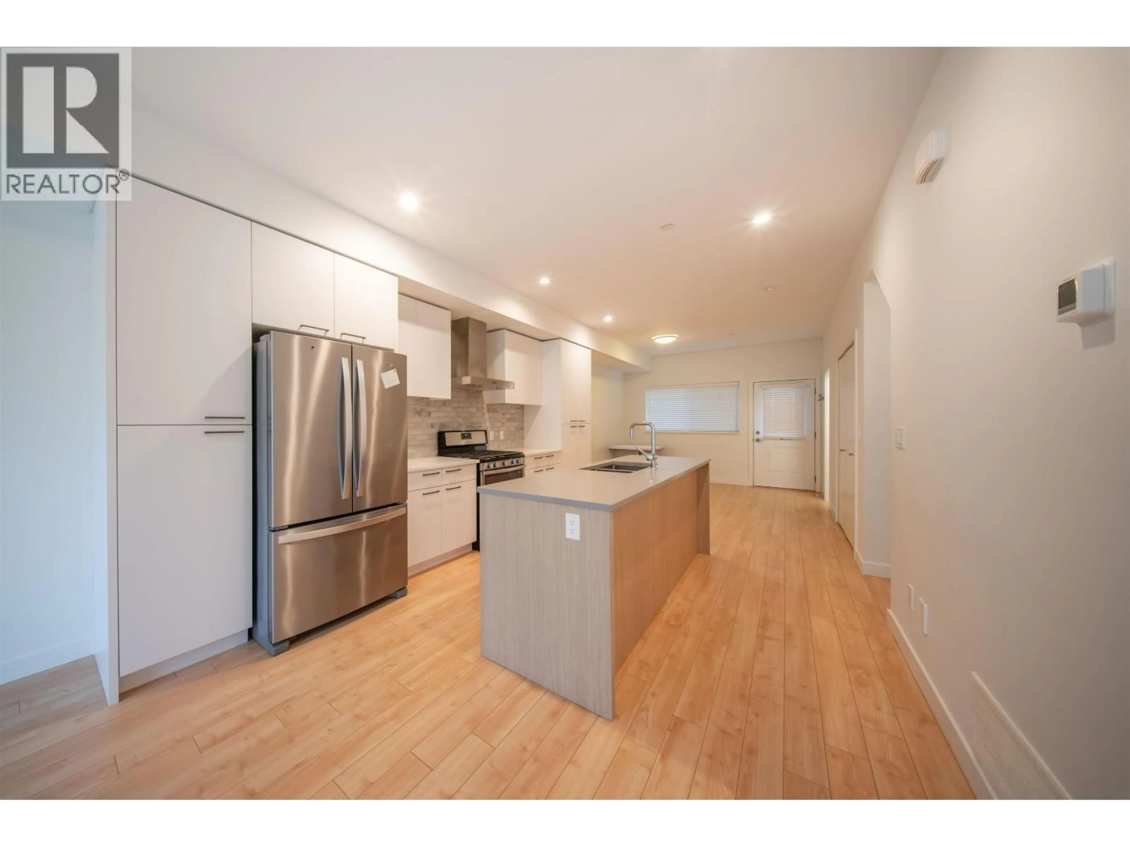 Open concept kitchen, wood/laminate floor for 2 - 22810 113 AVENUE, Maple Ridge British Columbia V2X3N2