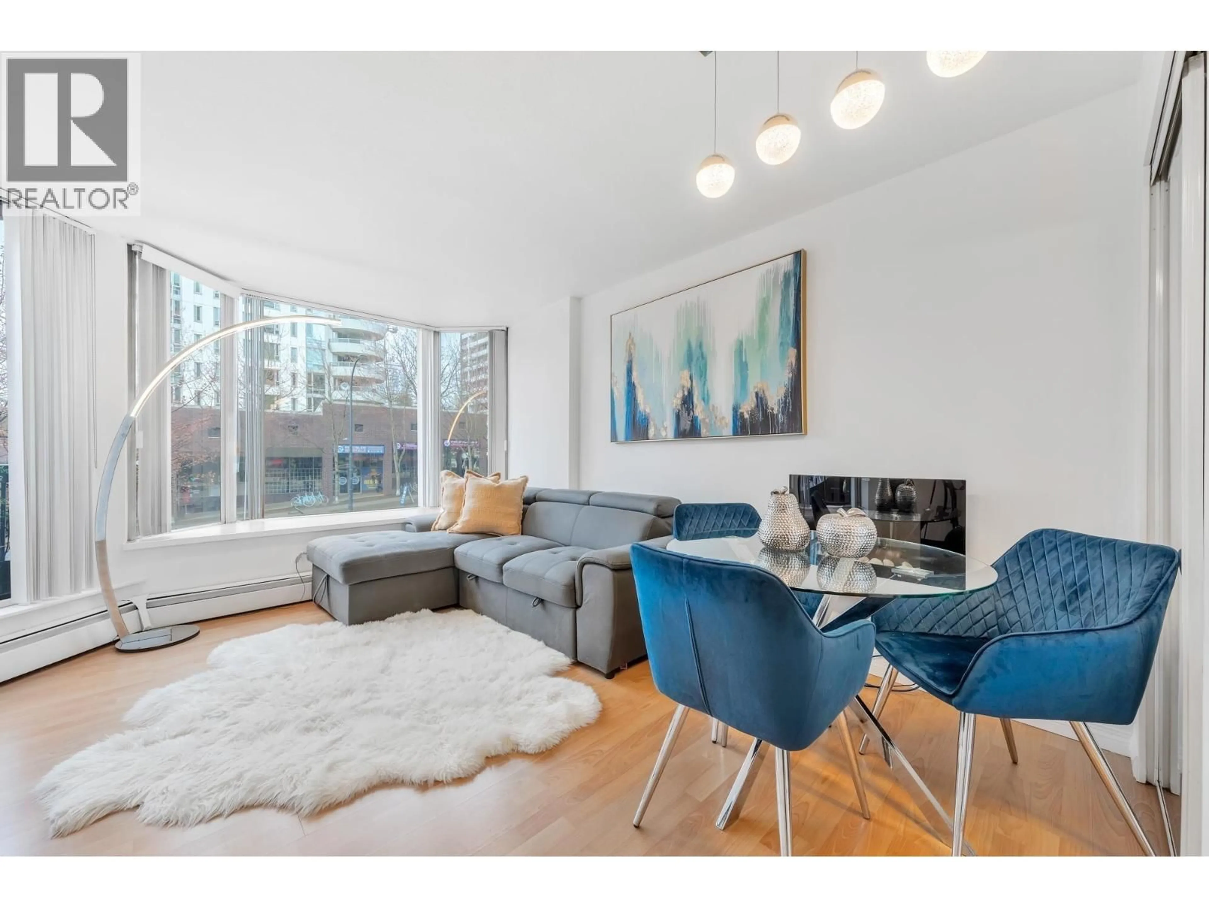 Living room with furniture, wood/laminate floor for 209 - 1330 BURRARD STREET, Vancouver British Columbia V6Z2B8
